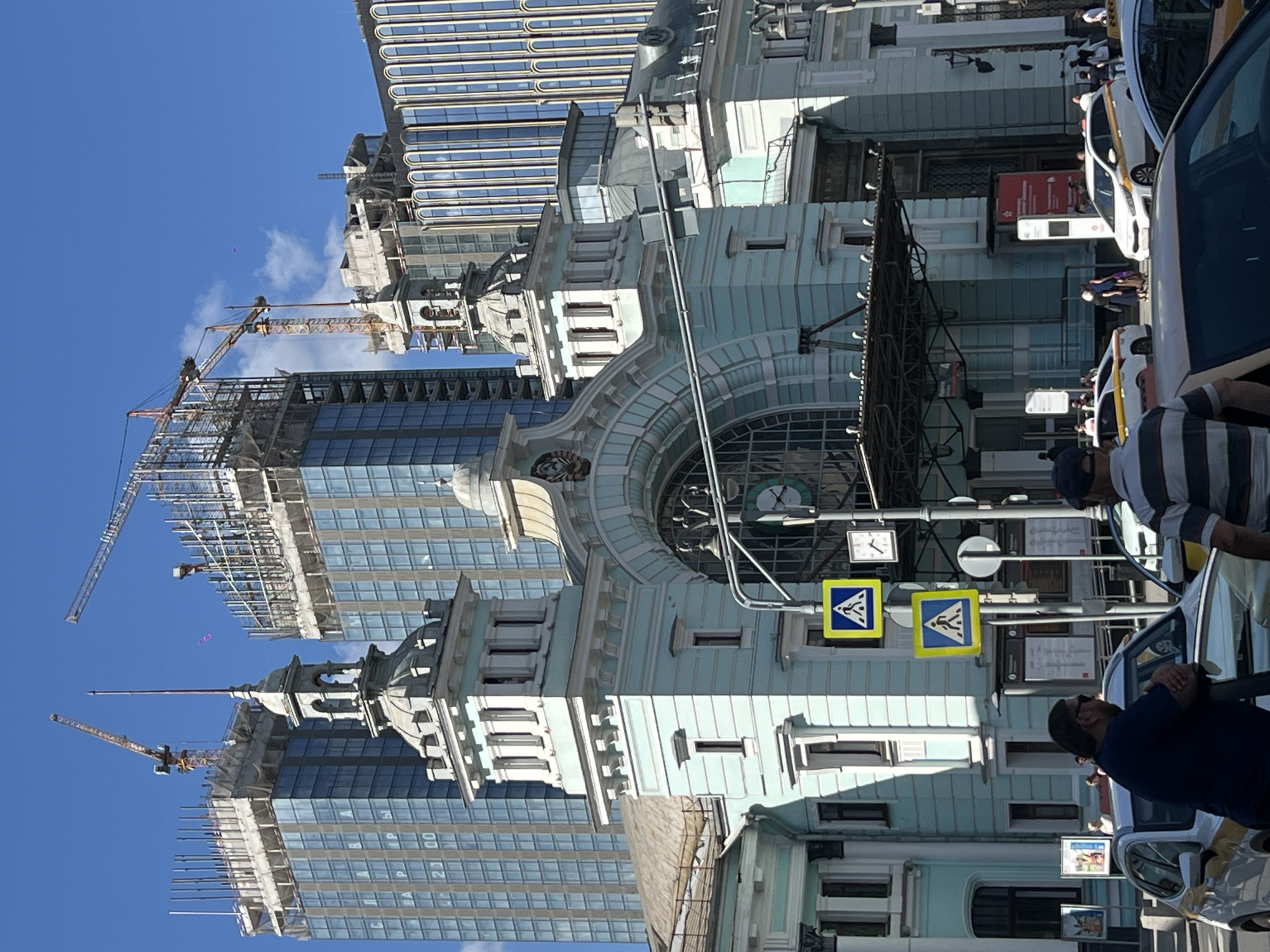 Daily life continues around Moscow's tourist landmarks and construction