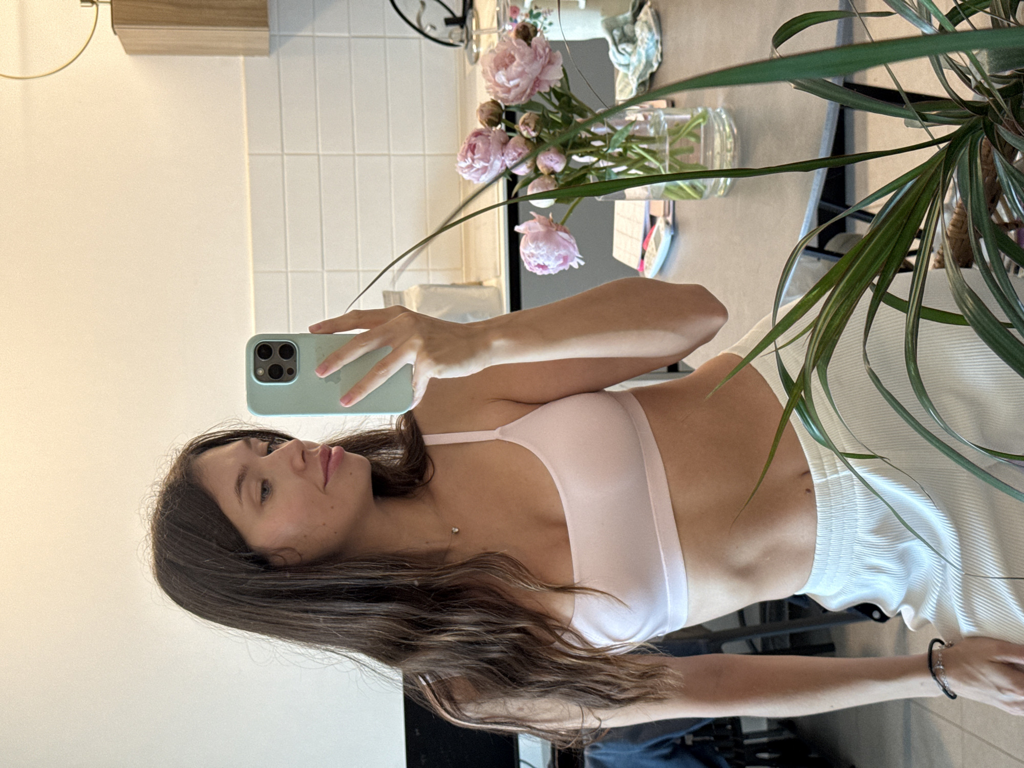 Kitchen selfie with a light green iPhone in Tel Aviv
