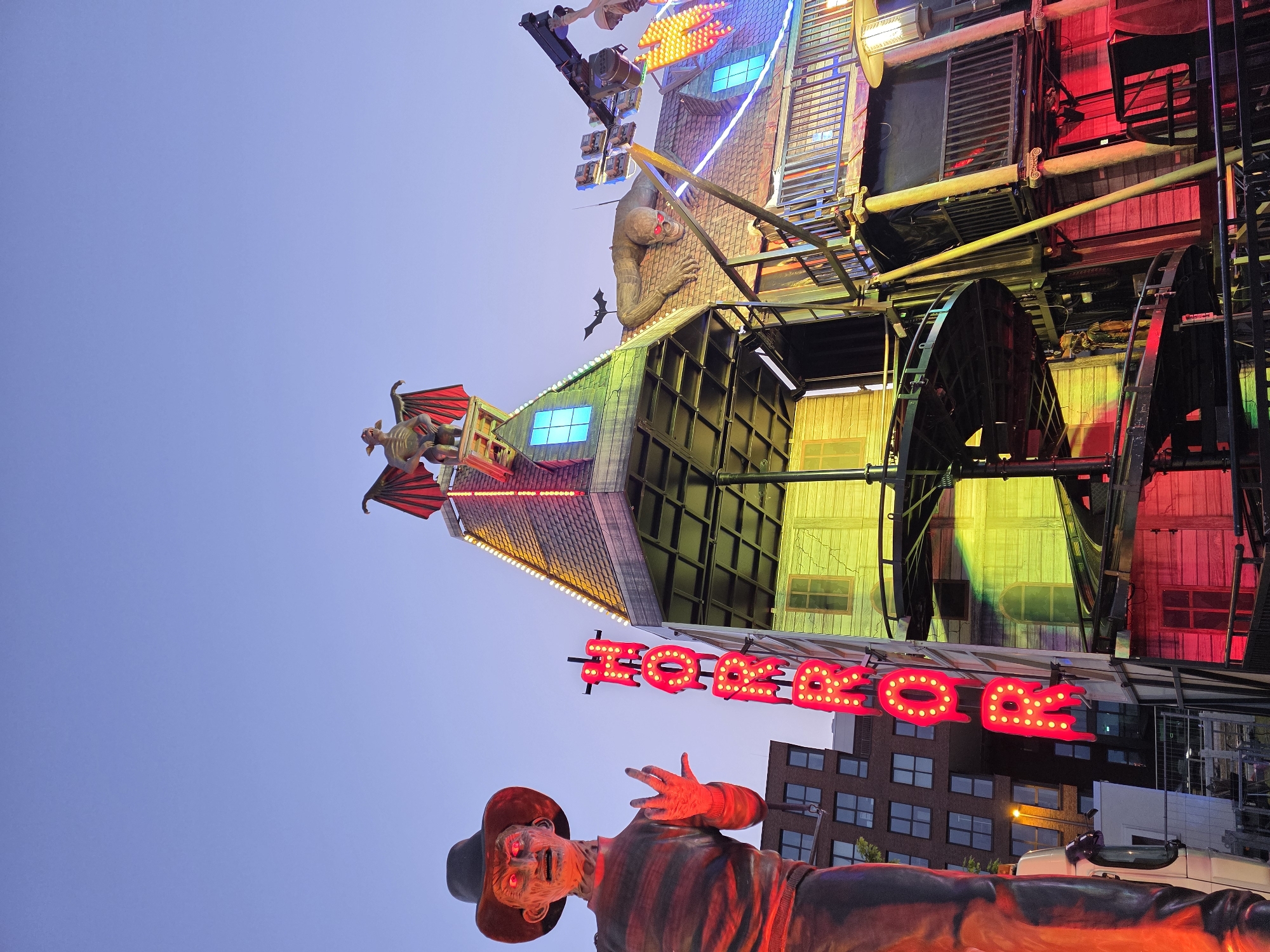 Kiel waterfront at dusk: harbor calm meets fairground lights