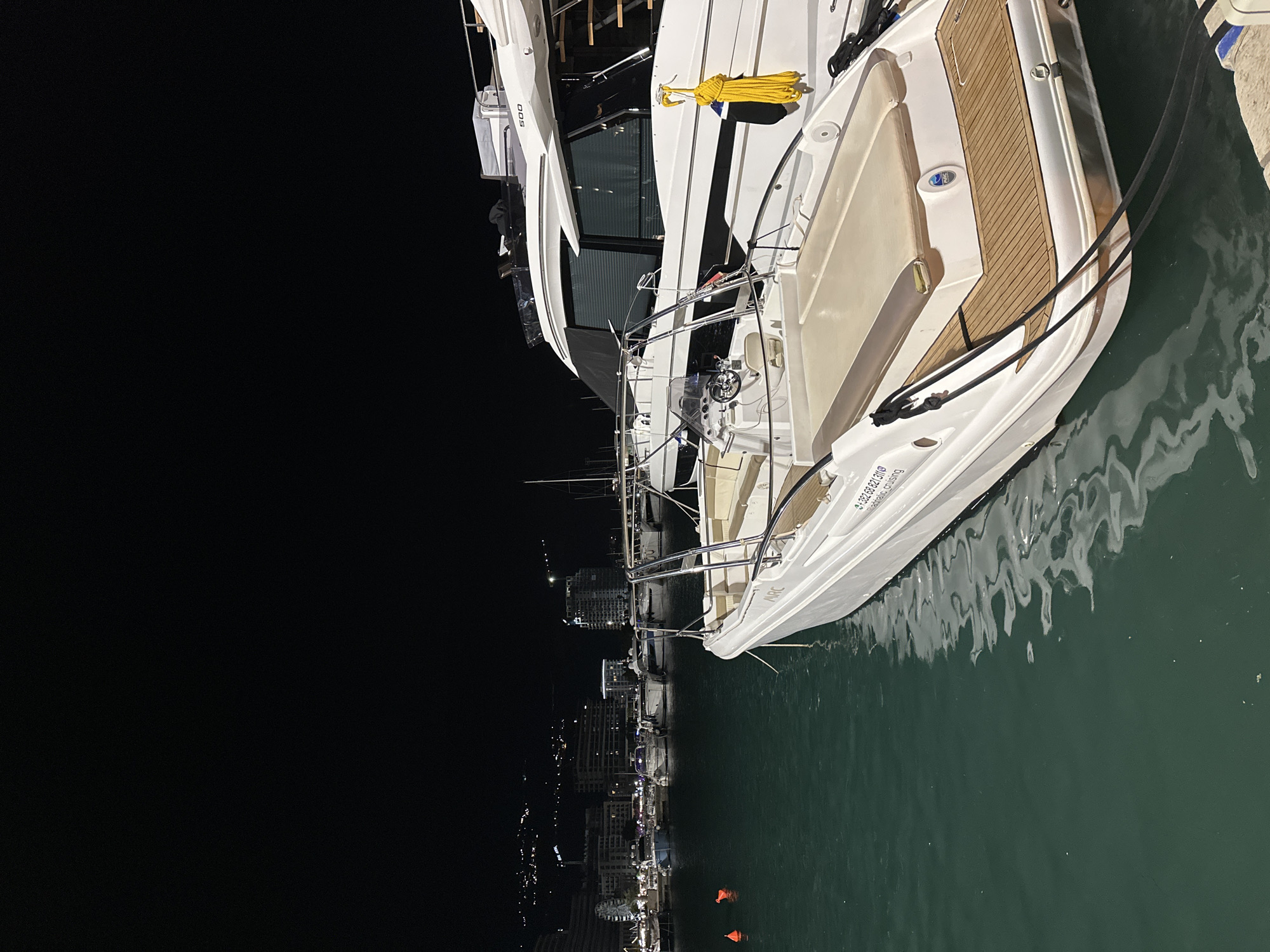 Luxury yachts light up Budva marina on a summer night
