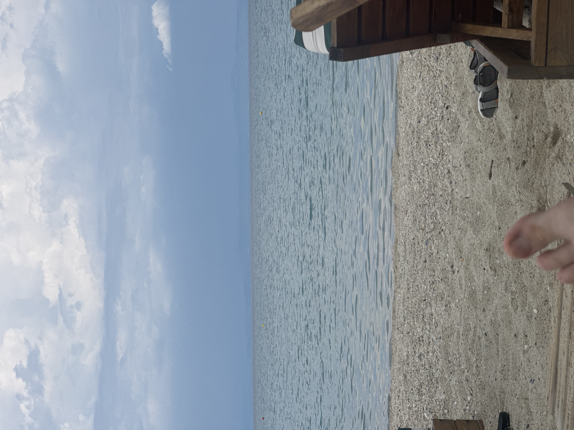 Summer beach day unfolds in Pallini, Greece with families and relaxation