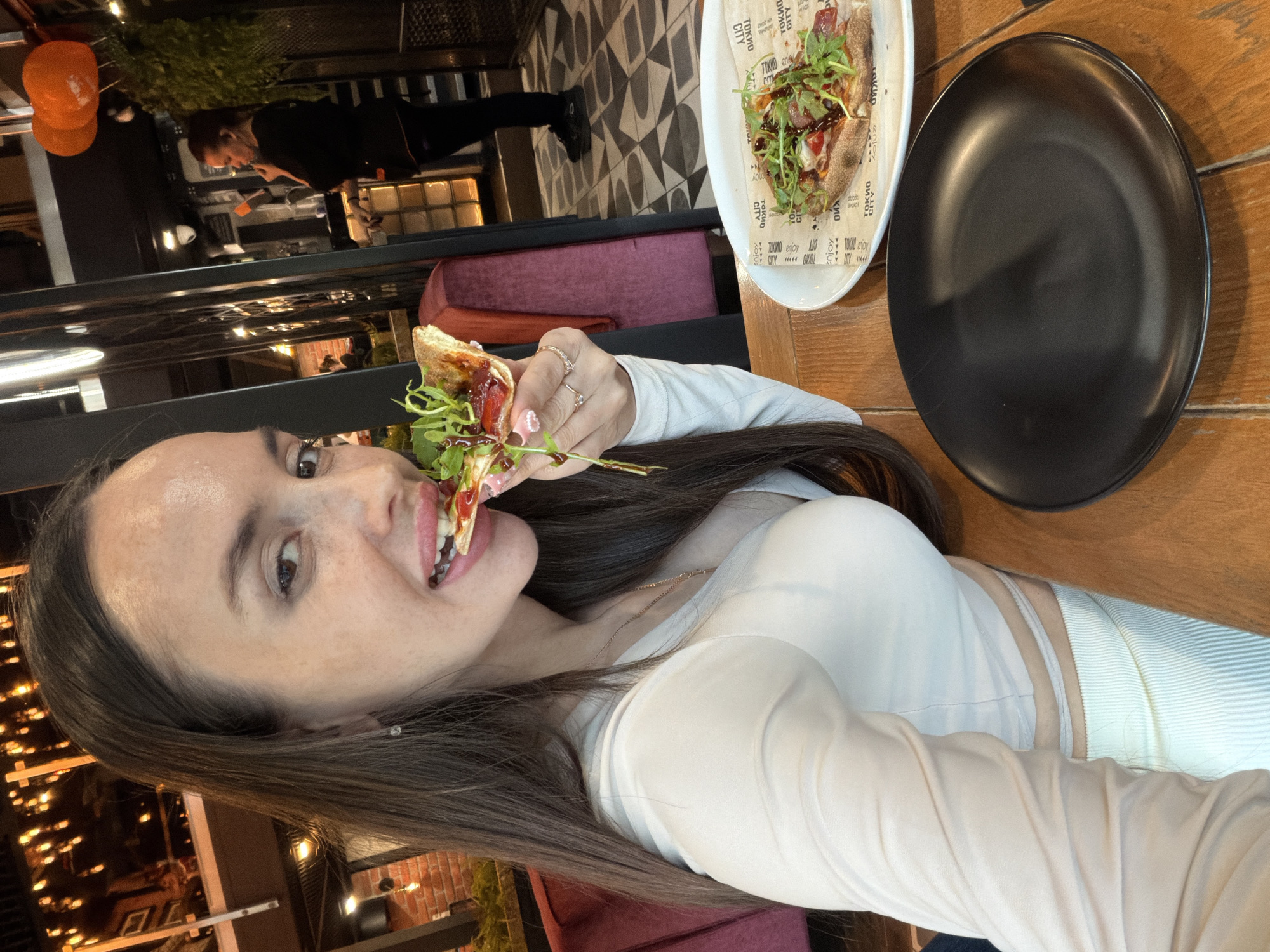 Woman documents sushi dinner with selfies at Saint Petersburg restaurant