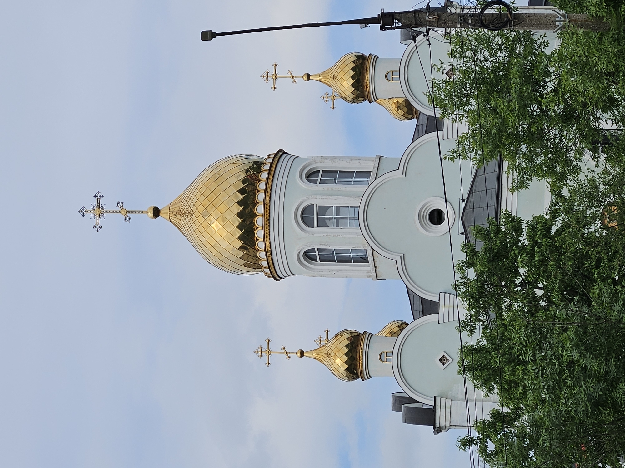Orthodox church with golden domes observed in Rodniki, Russia