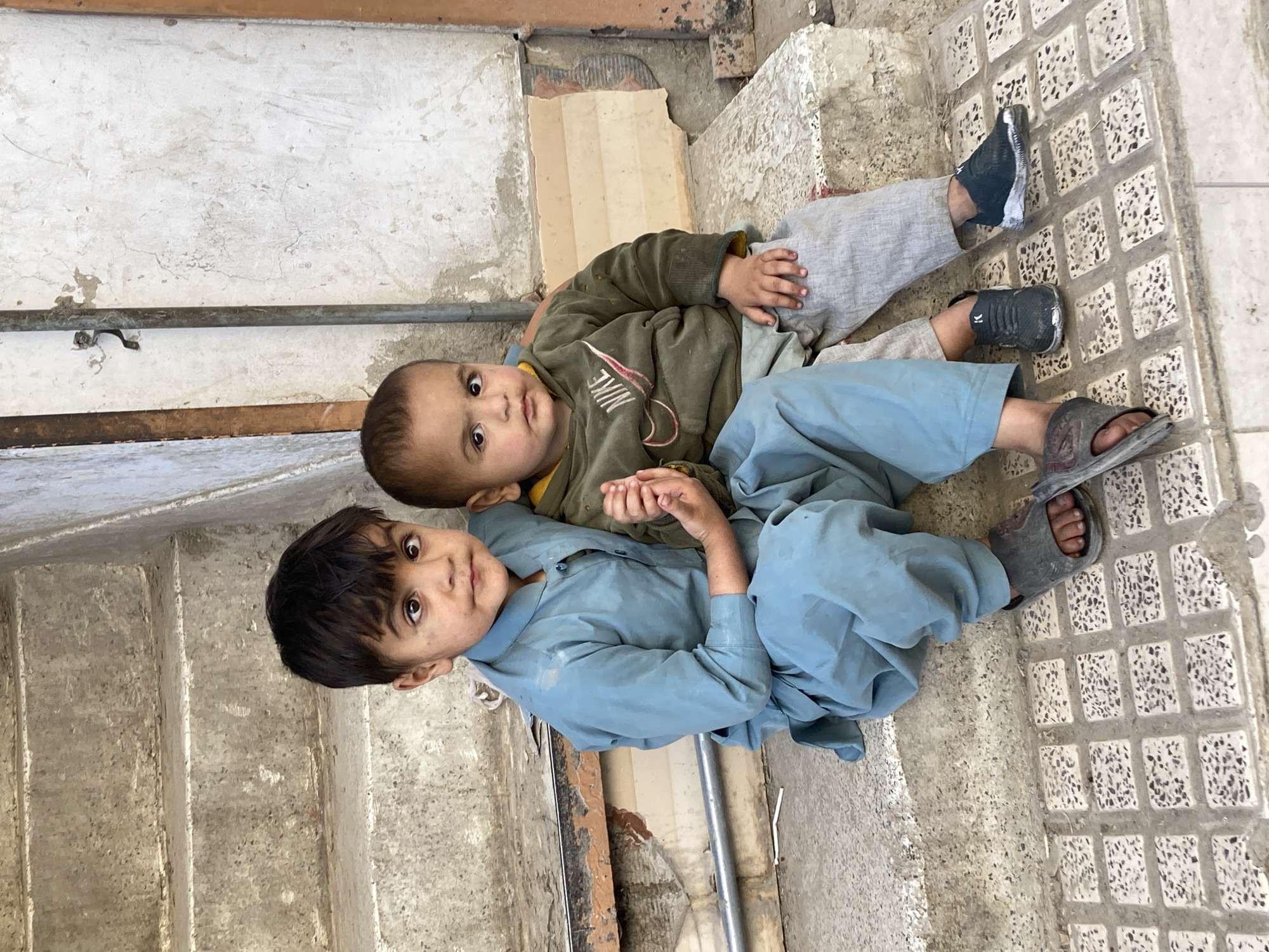 Children play on concrete structures in Quetta