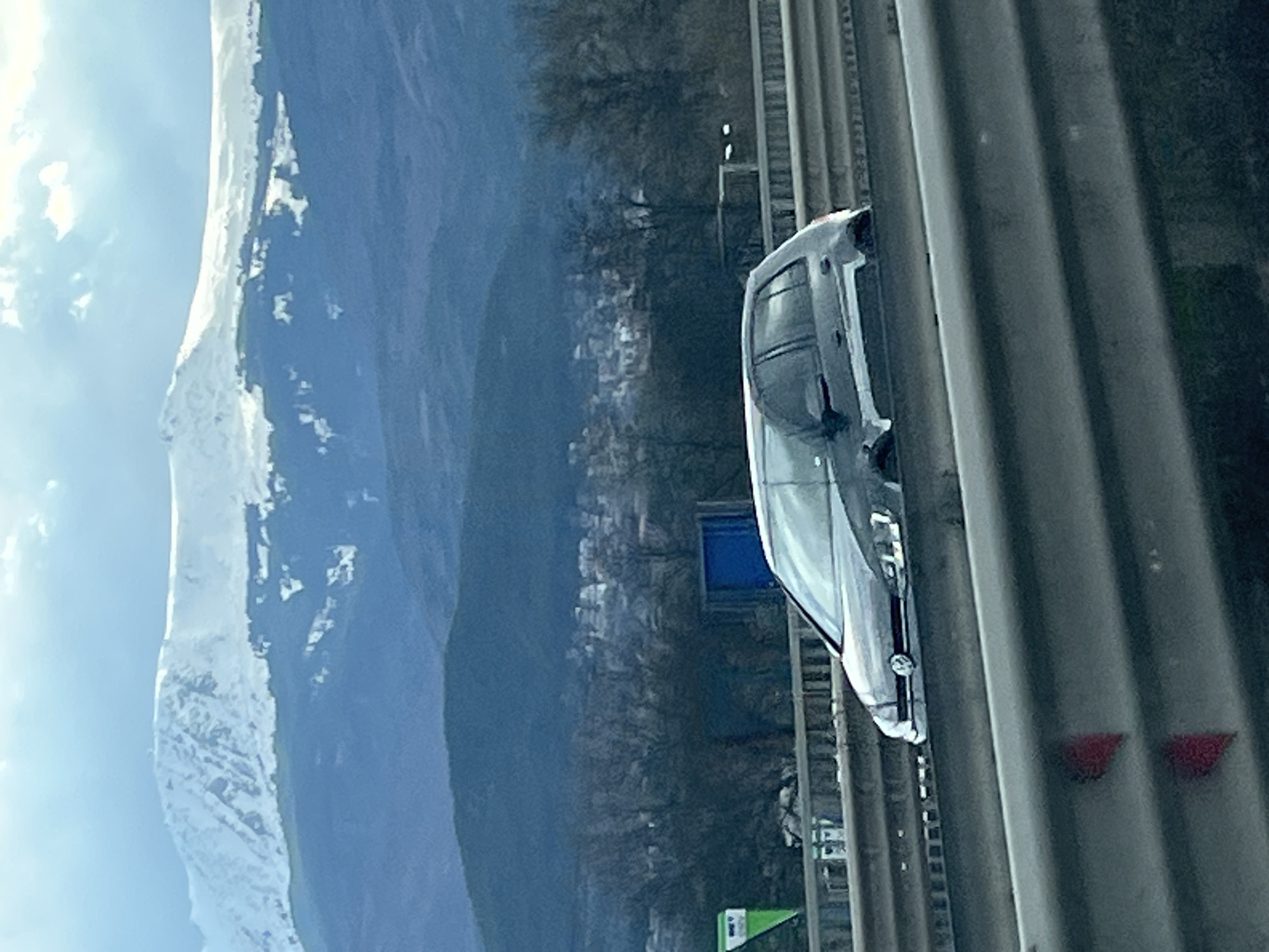 Highway journey past mountains and roadside signage documented