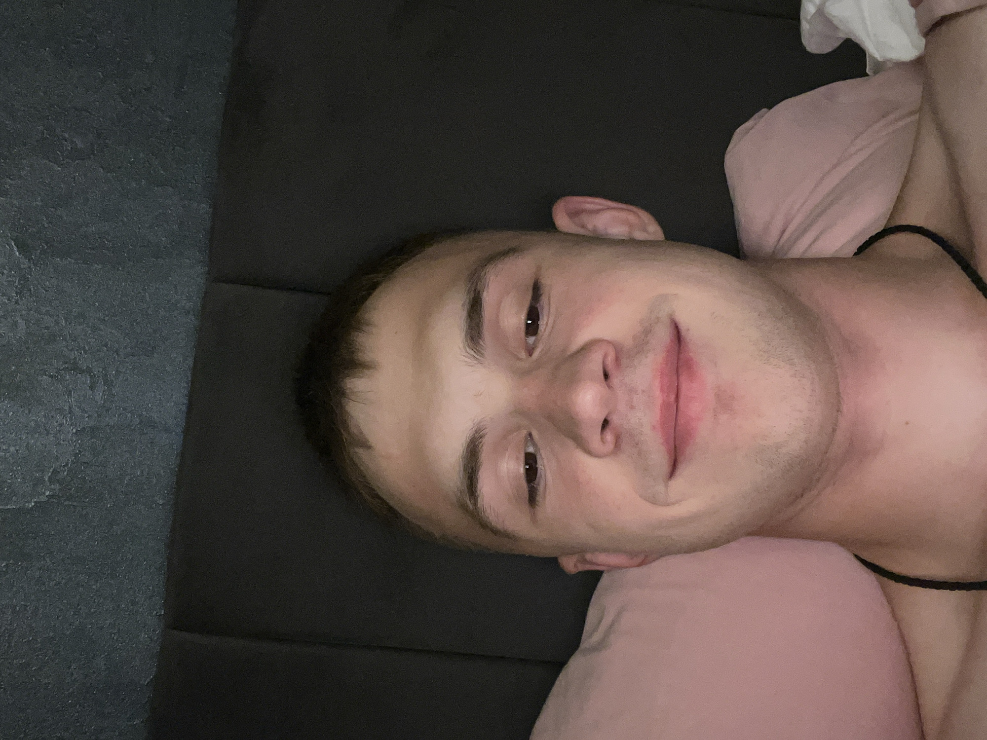 Casual bedroom selfie series on pink pillows