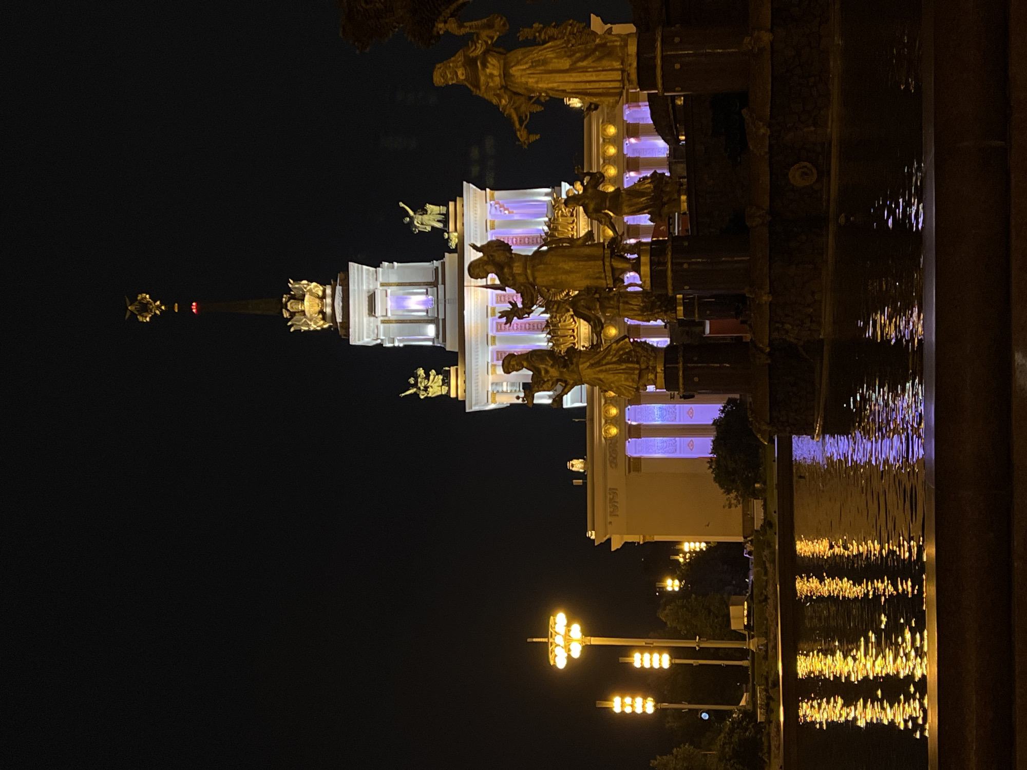 VDNKh at night: illuminated fountain and car displays