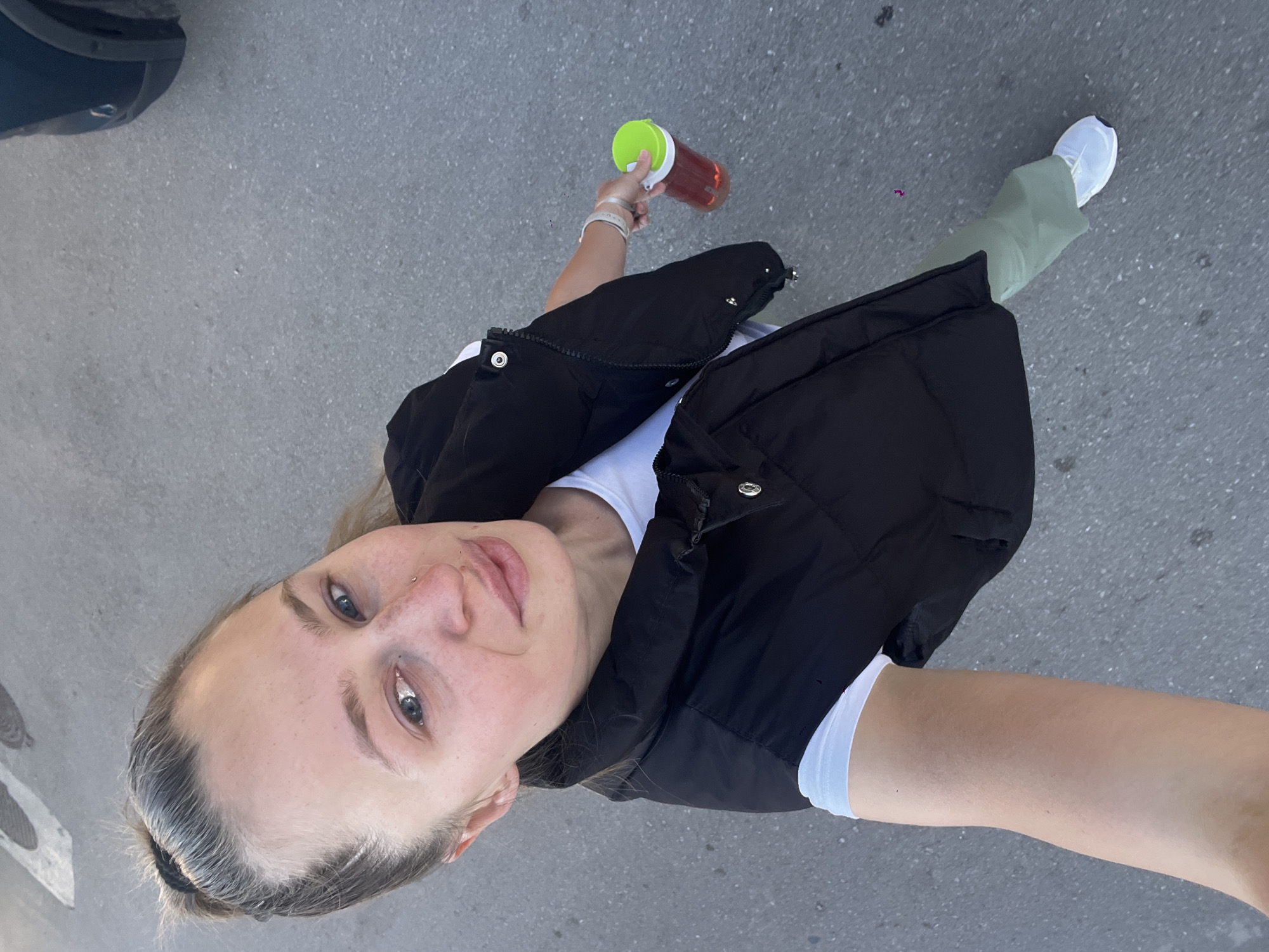 Person photographed from above on street in Bečići, Montenegro