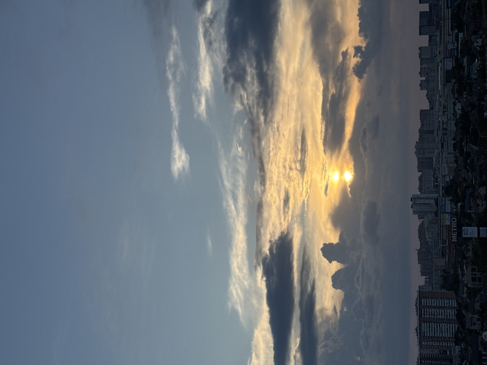 Krasnodar skyline at sunset, clouds and golden light