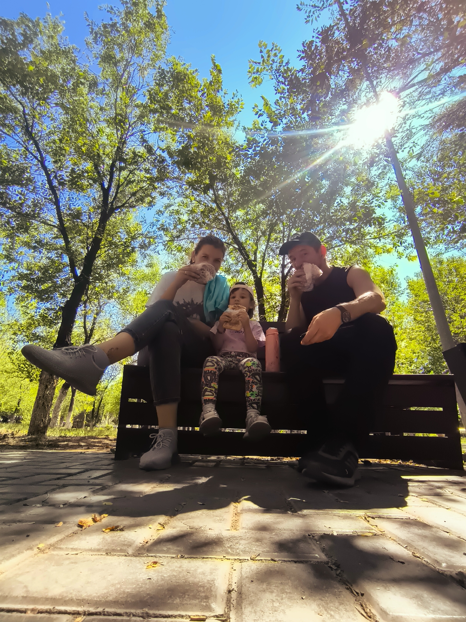 A sunny afternoon on a park bench in Qarağandı