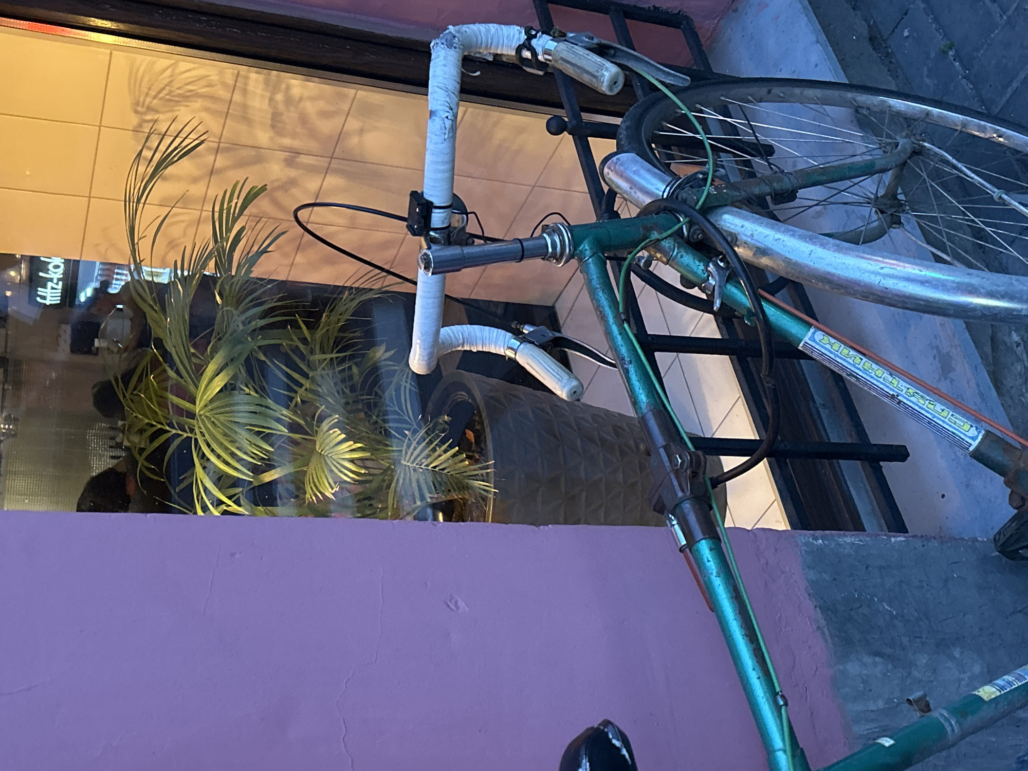 Hanging out around a quirky café with vintage bikes and neon signs