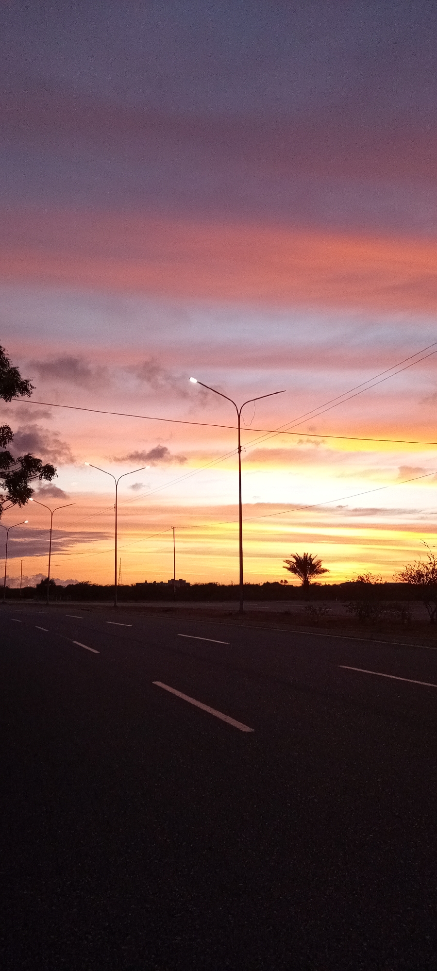 Witnesses document vibrant sunset over roads and neighborhoods April 22