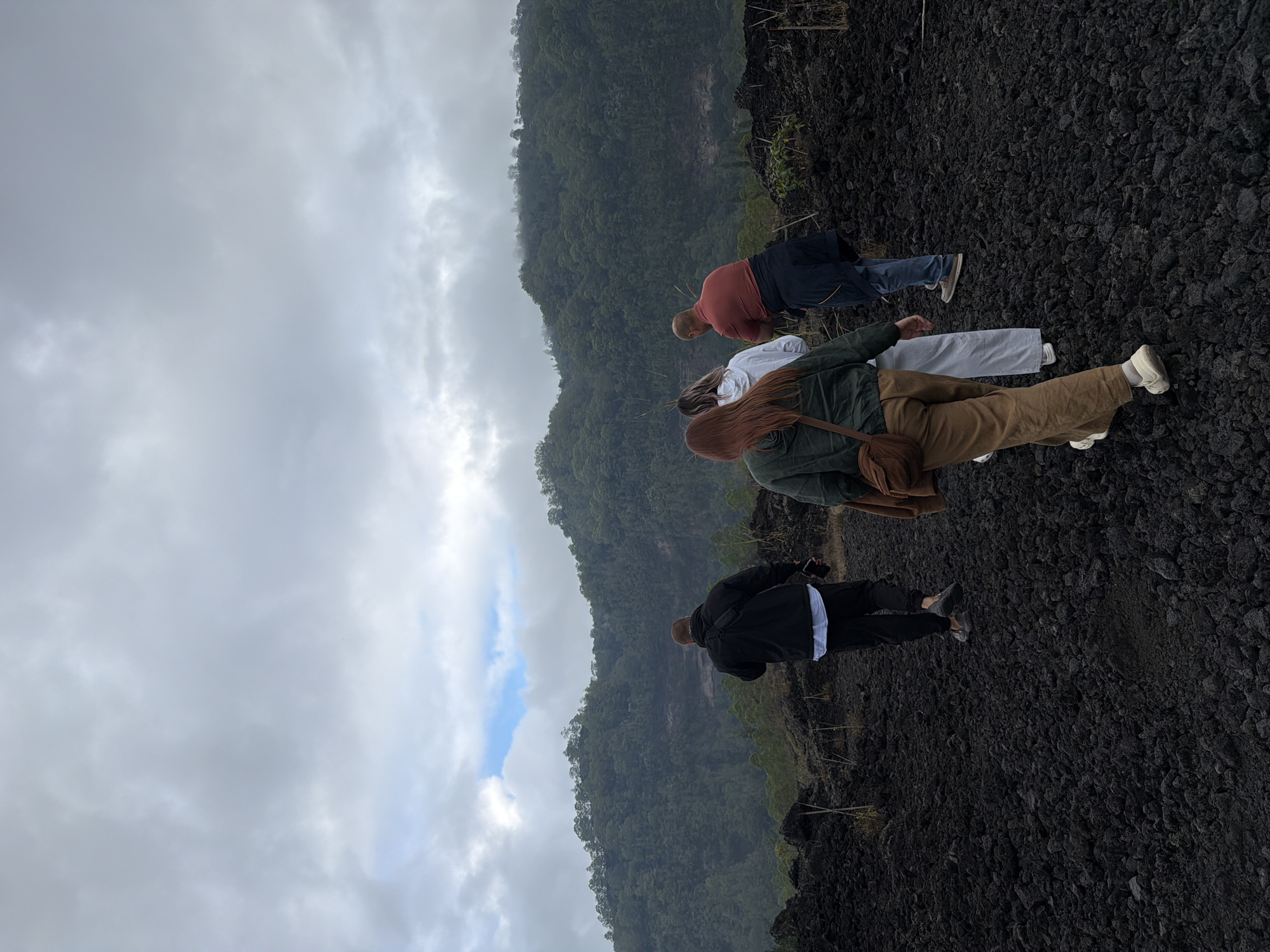 Exploring Kintamani's volcanic lava fields on a cloudy morning