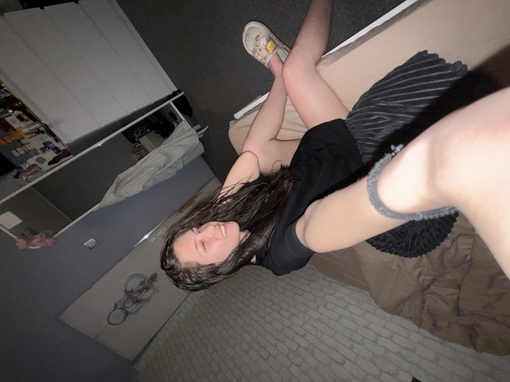 Woman resting on bed in Sofia apartment