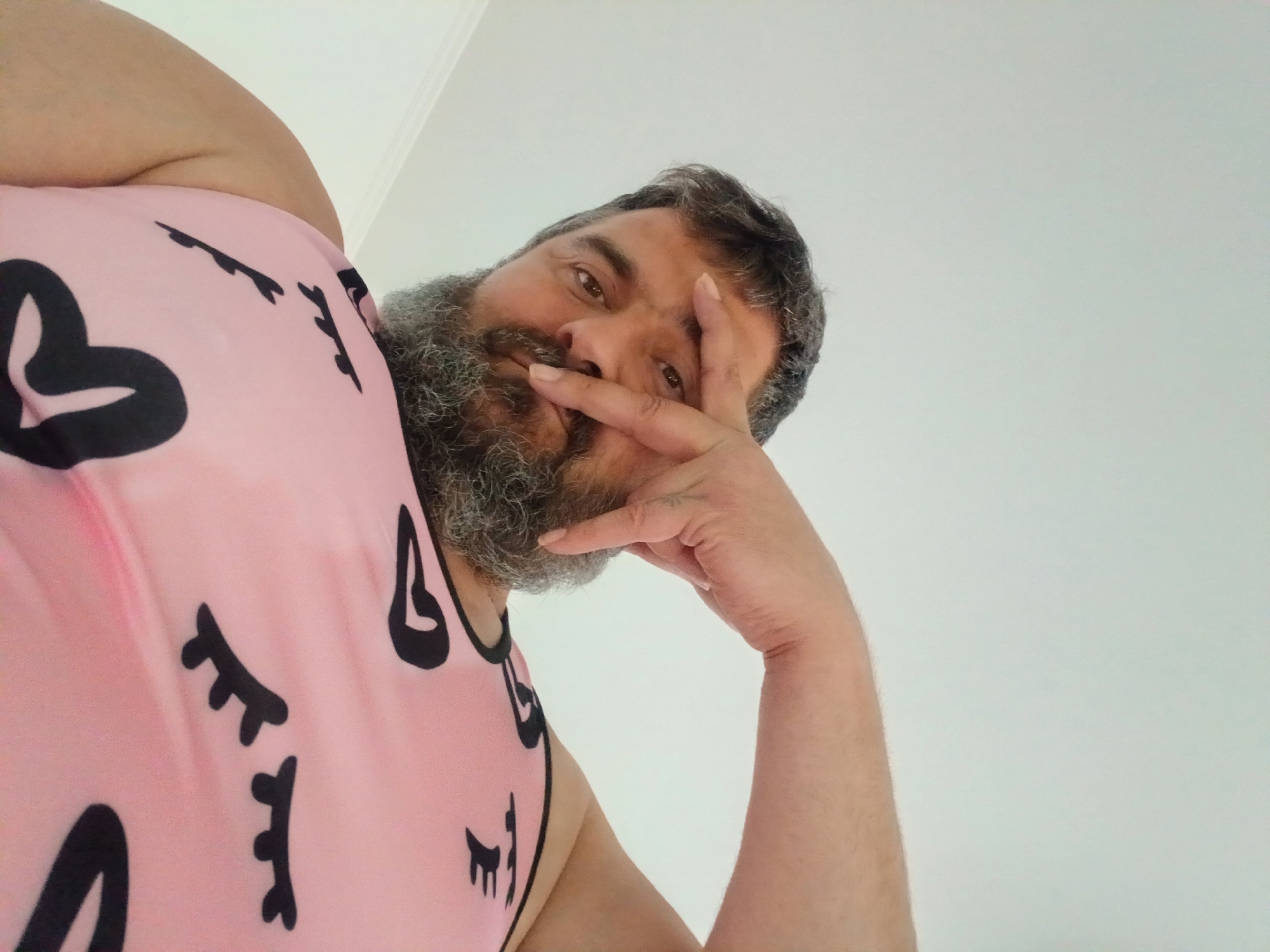 Bearded person poses and gestures for the camera in Pfarrkirchen
