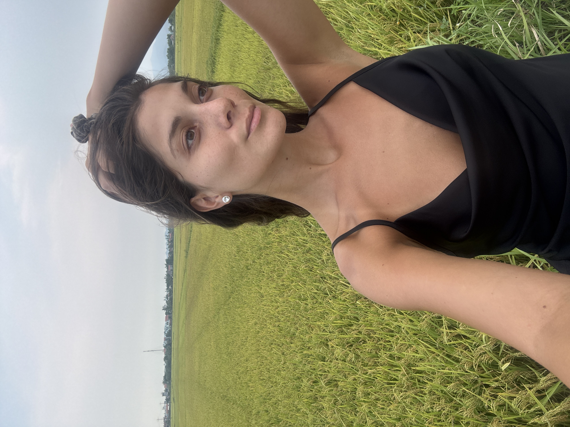Woman photographs rural rice paddies in Đà Nẵng Vietnam