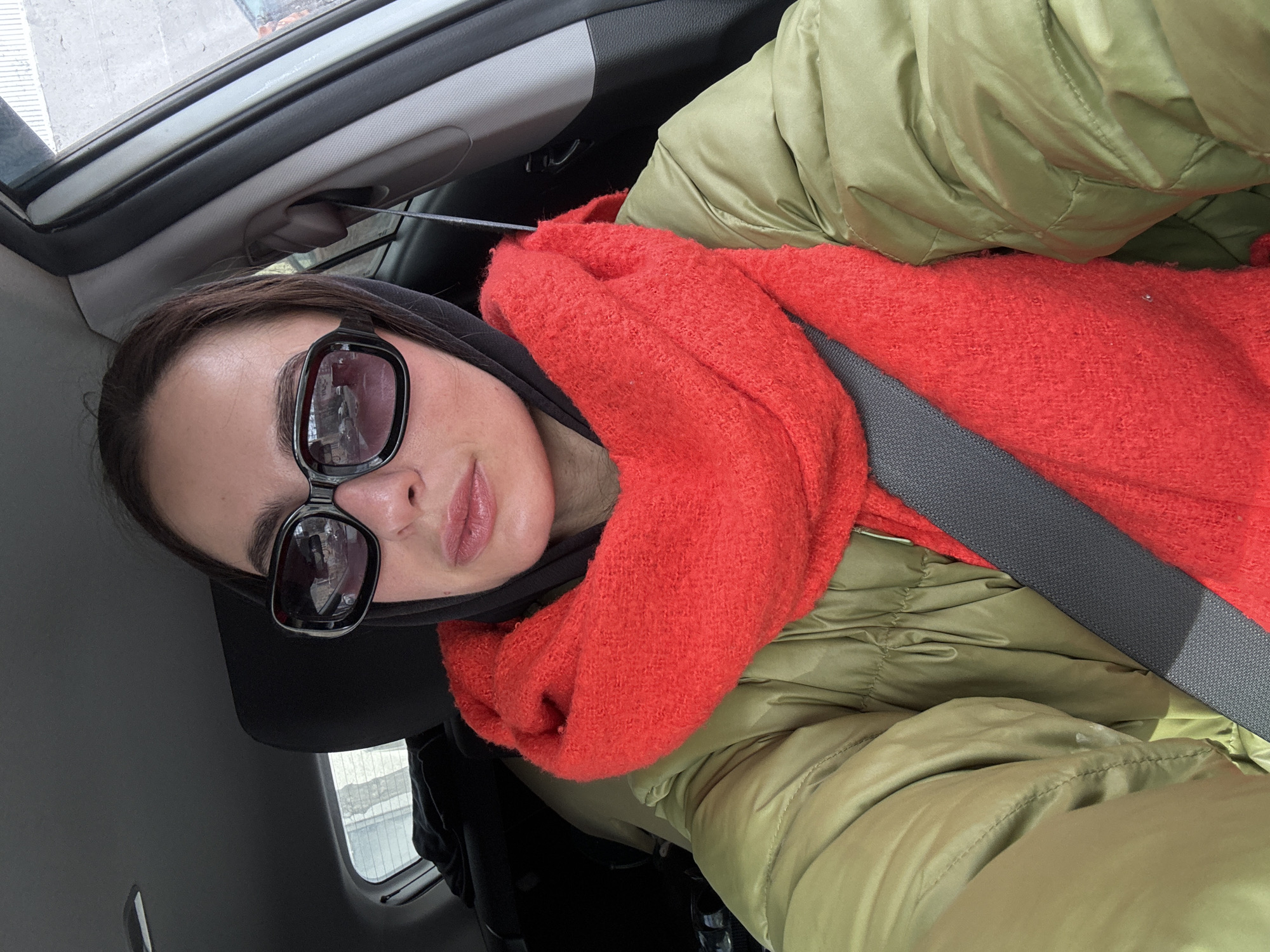 Woman in winter clothing observed in vehicle, Krasnoyarsk