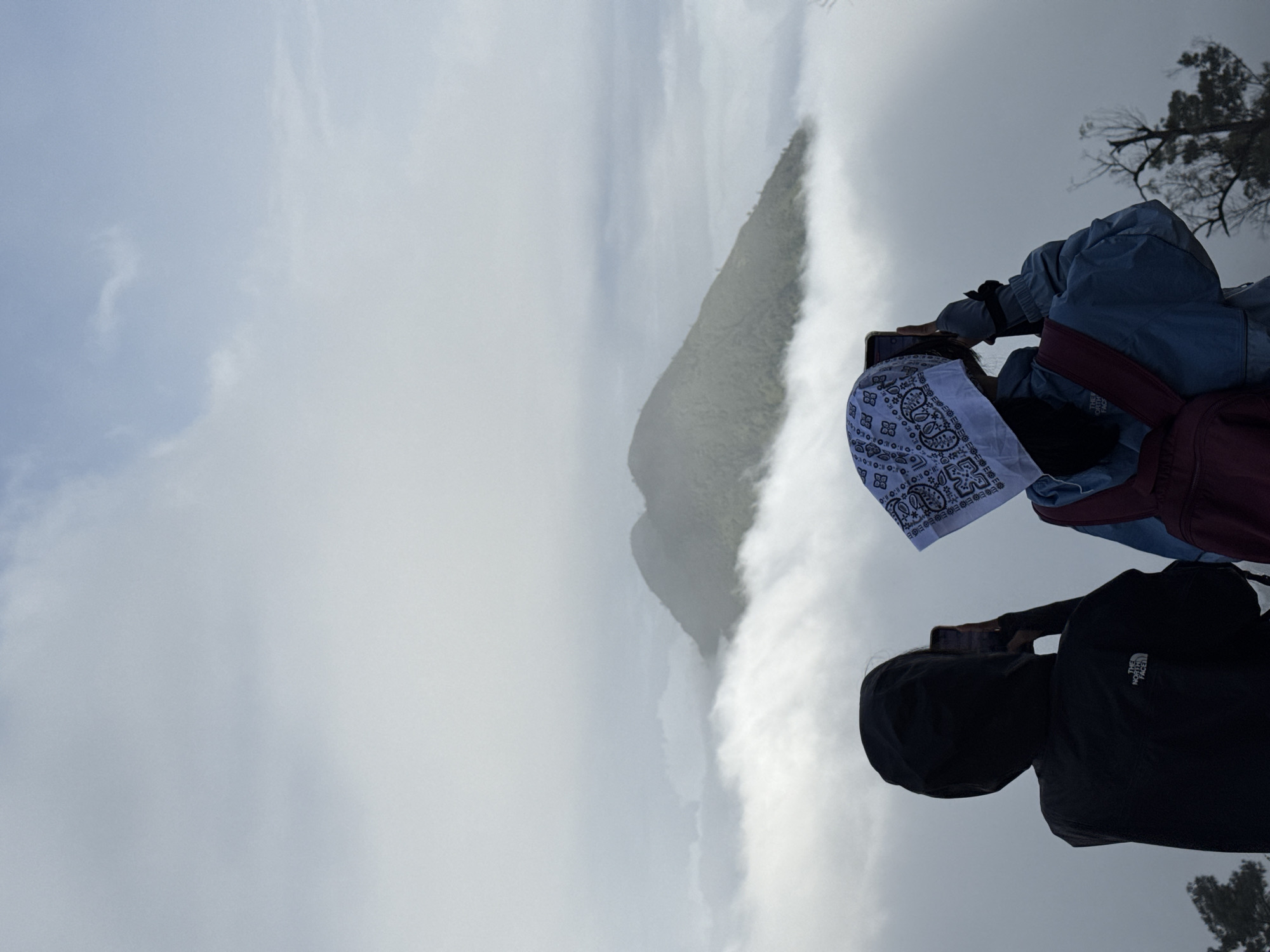 Photographers capture foggy mountain views from Indonesian overlook