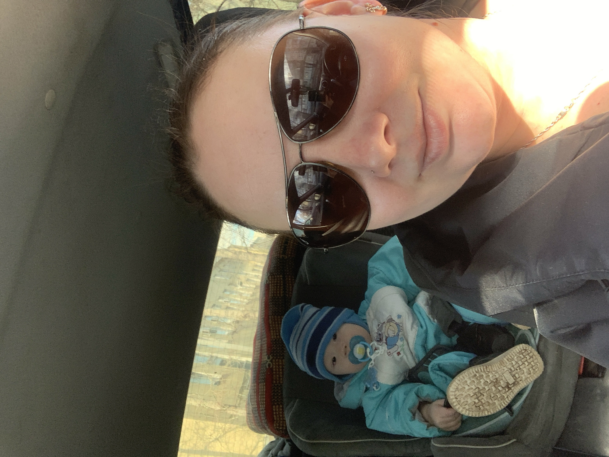 Woman takes car selfie with child in Izhevsk