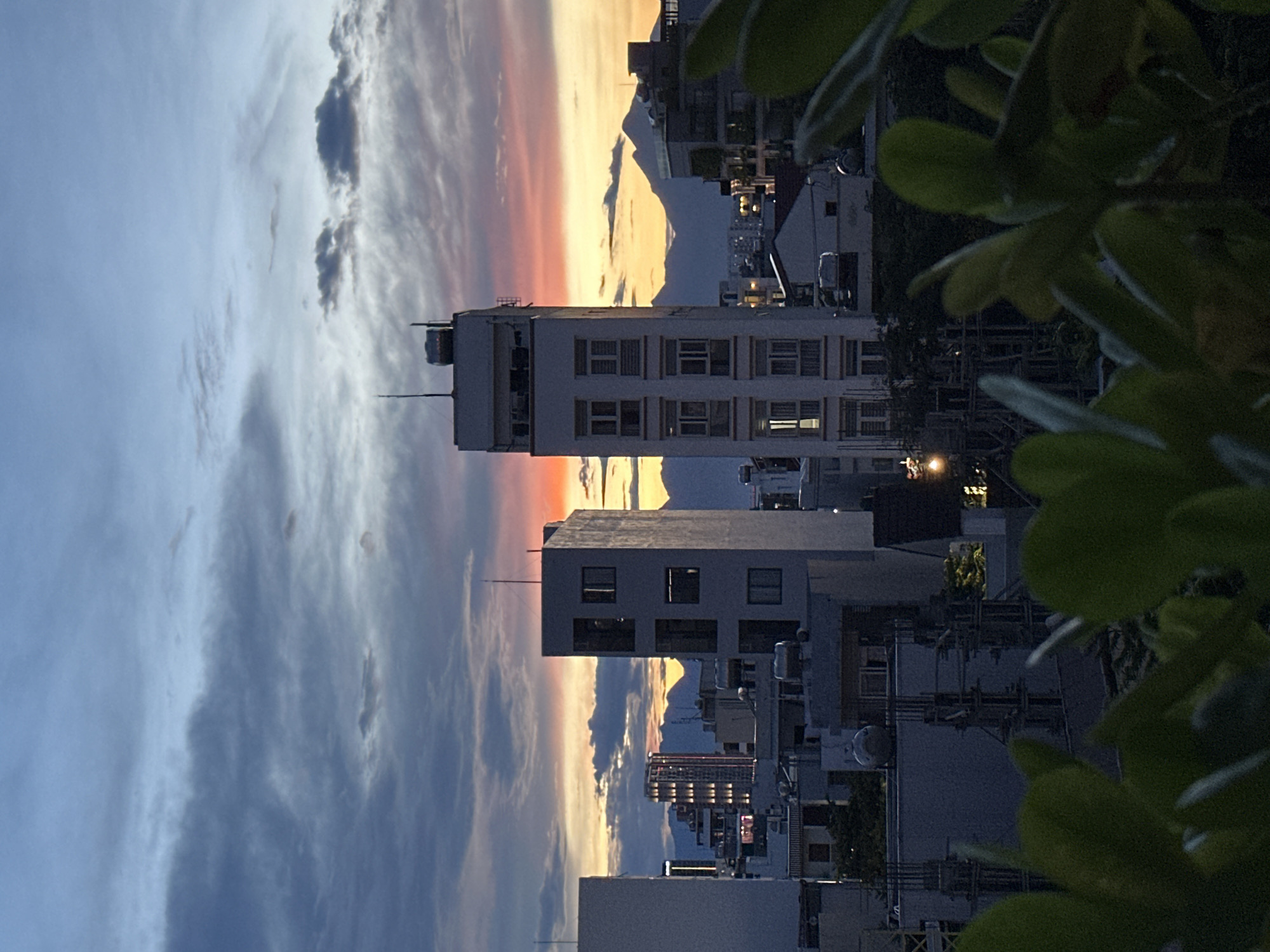 Da Nang skyline at dusk, rooftop views through shifting skies