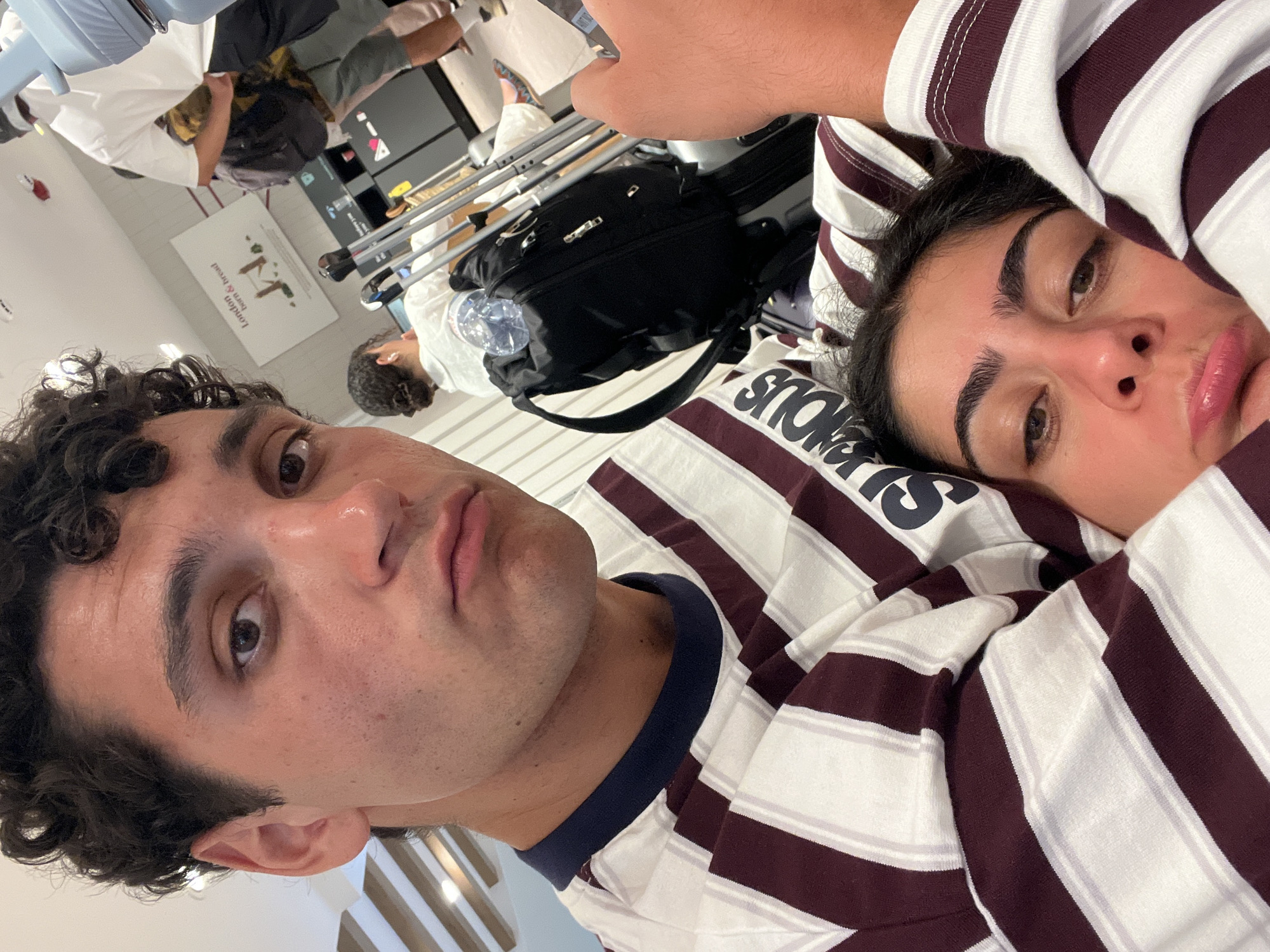 Couple selfies in Mykonos, matching outfits, indoor setting