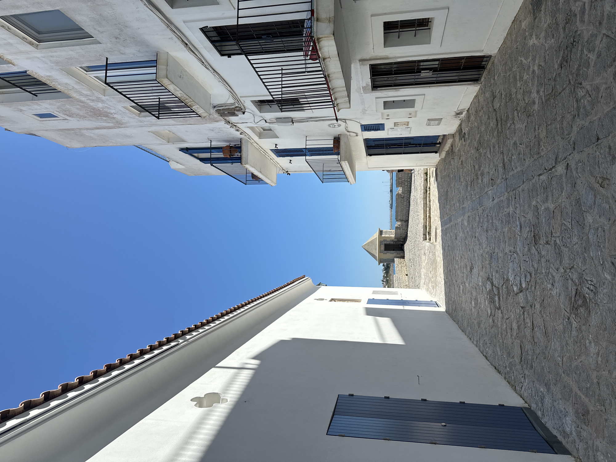 Witness documents Ibiza's white architecture and harbor yacht