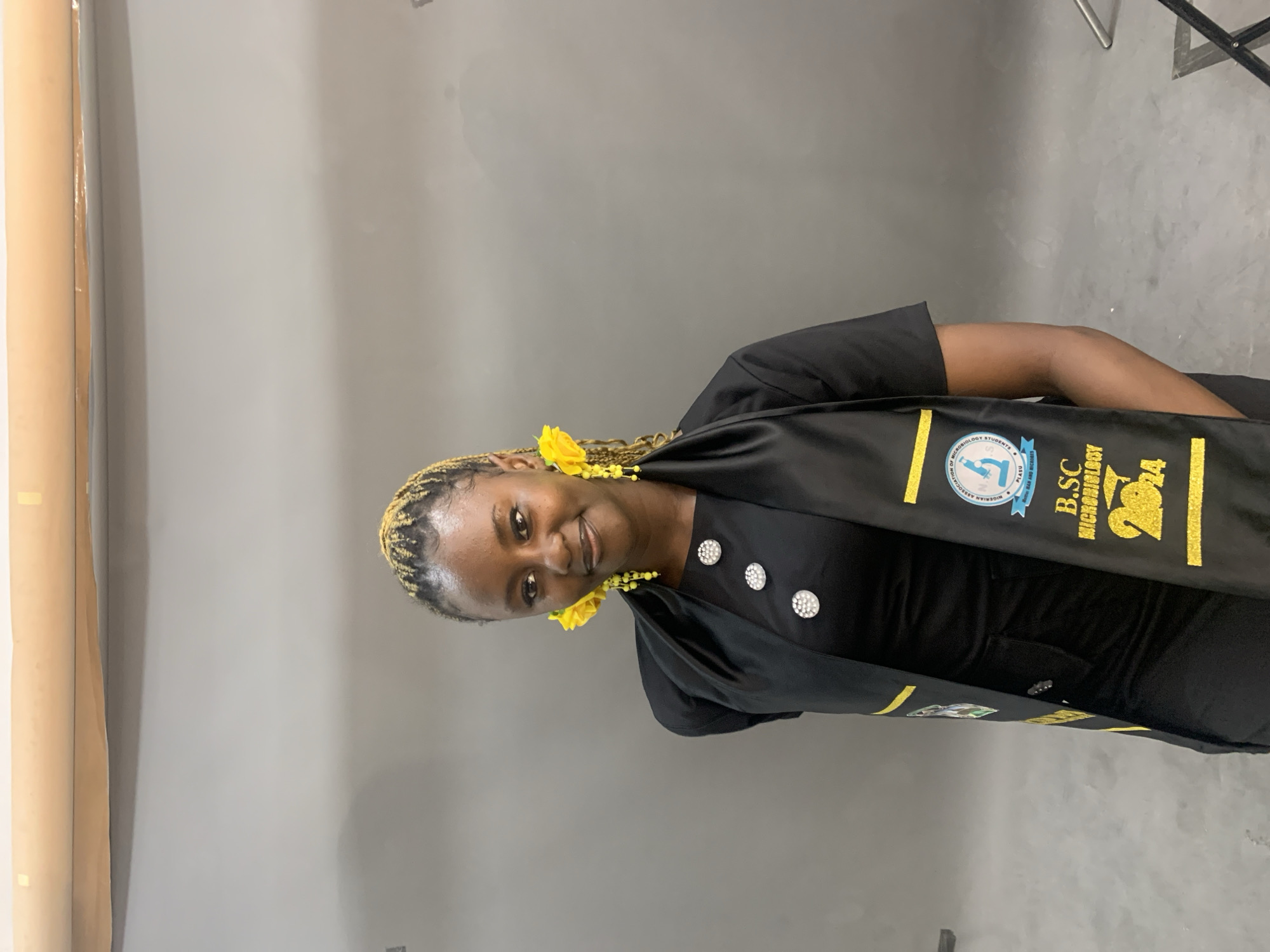 Graduation photography session documents microbiology degree celebration in Nigeria