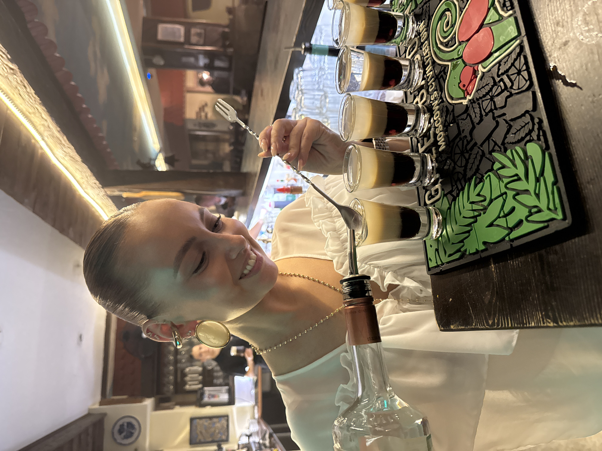 Bartender prepares shots at bar in Chaikovsky, Russia