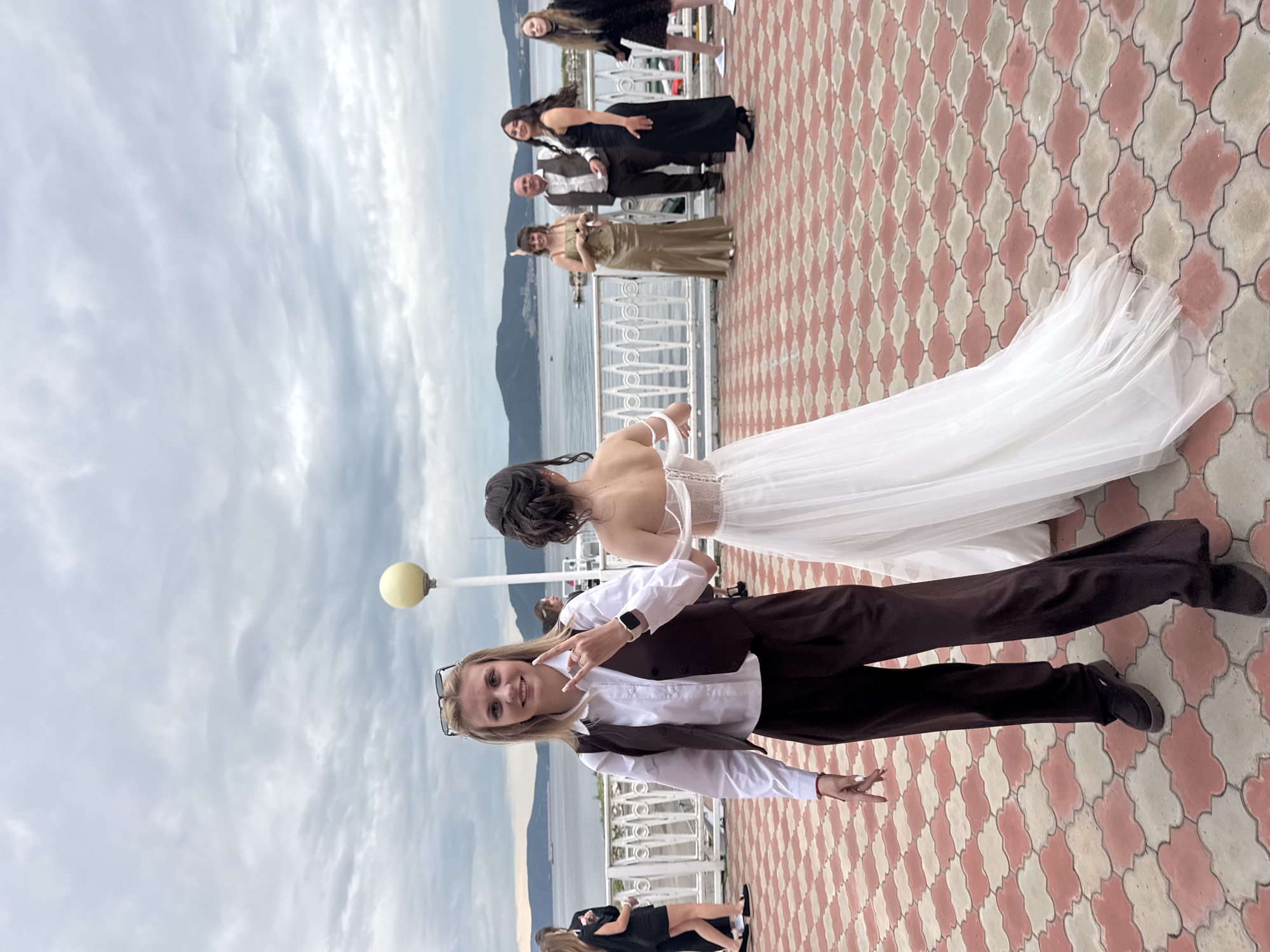 Wedding celebration held at waterfront venue with outdoor ceremony, indoor reception