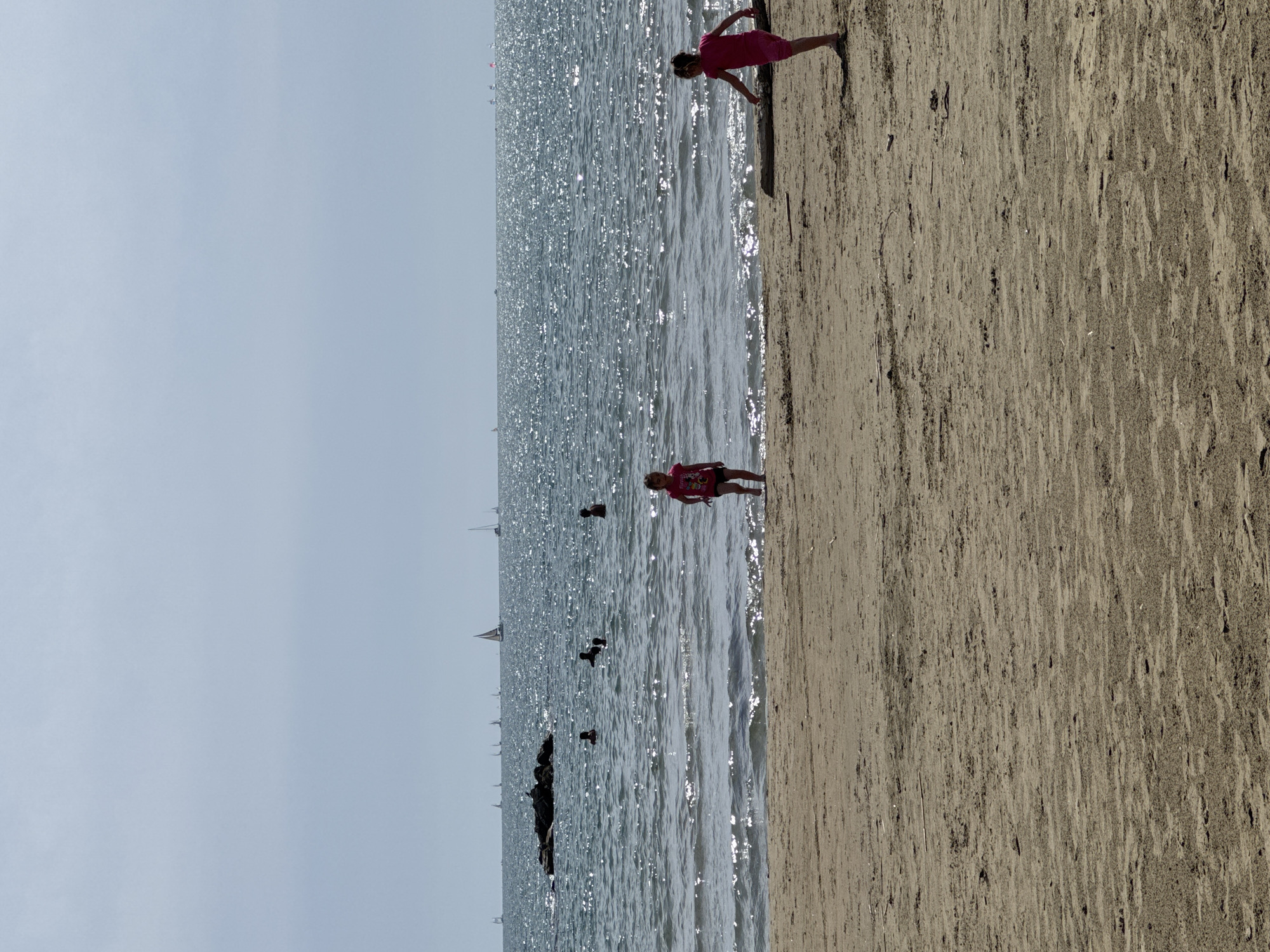 Families enjoy sunny afternoon at Nettuno beach, Italy