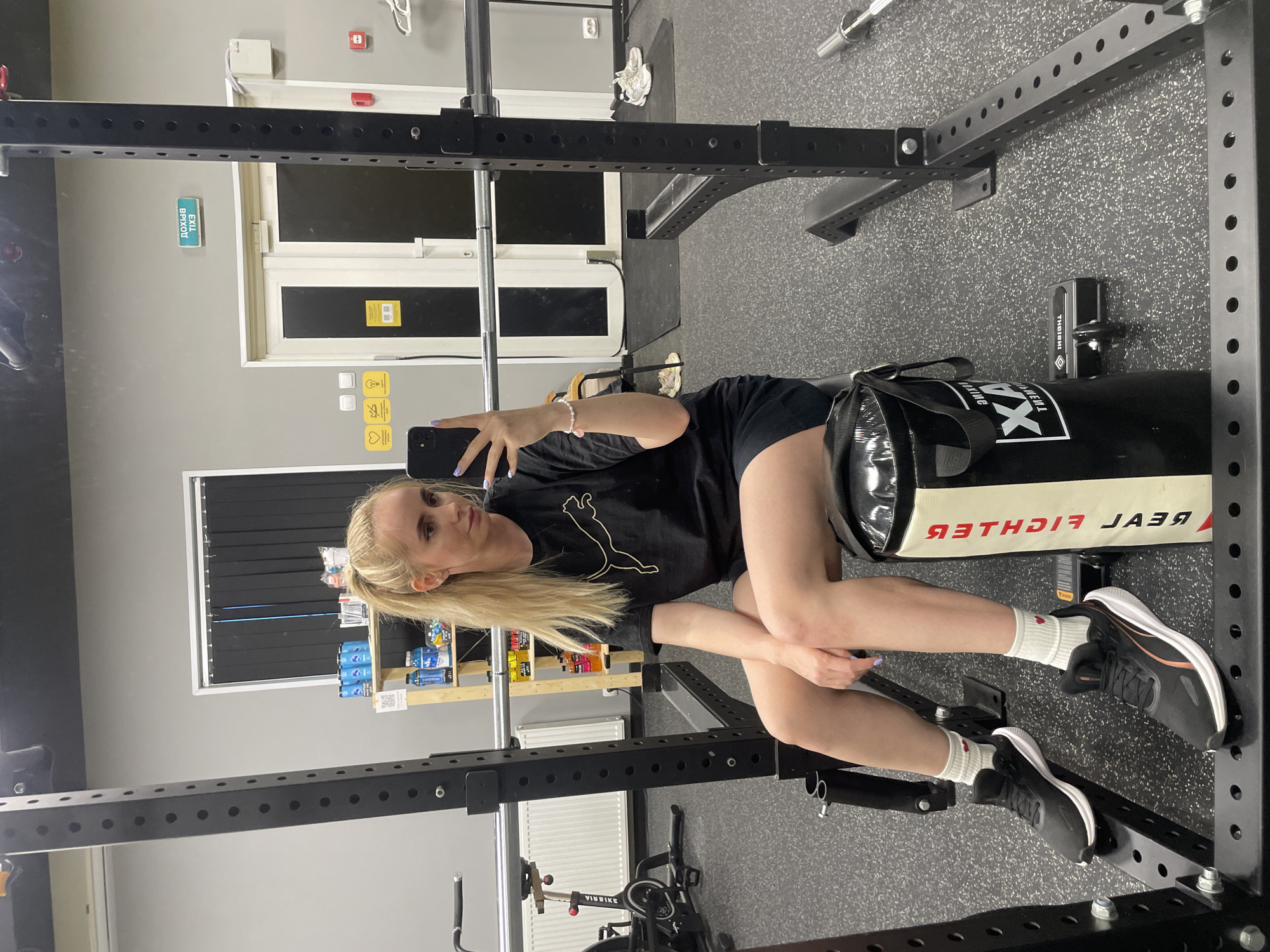 Woman takes gym selfie on punching bag in Vladivostok