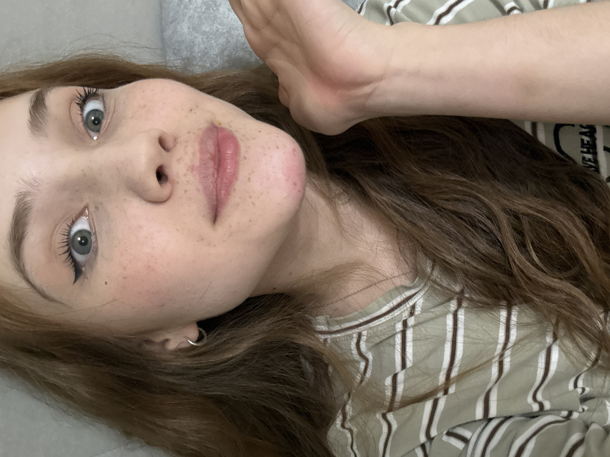 Young woman takes multiple selfies indoors in Naberezhnye Chelny