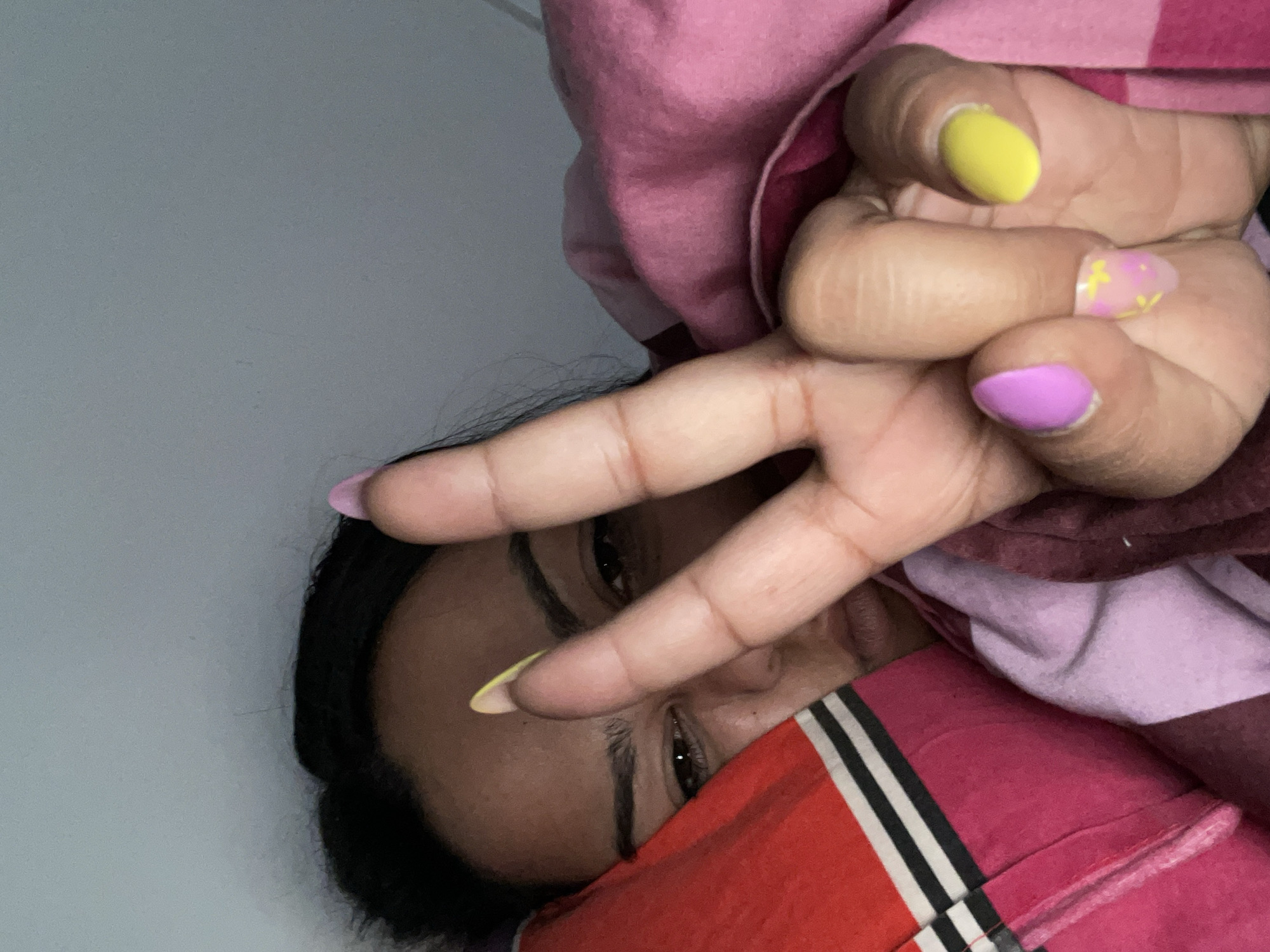 Woman makes peace sign gesture in Dronten