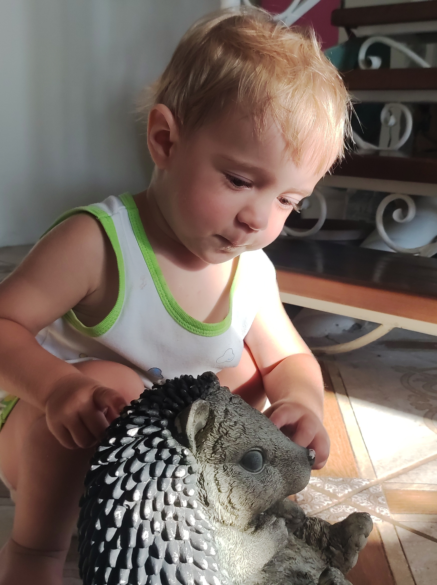 Hedgehog toy and roasted potatoes on a tiled afternoon