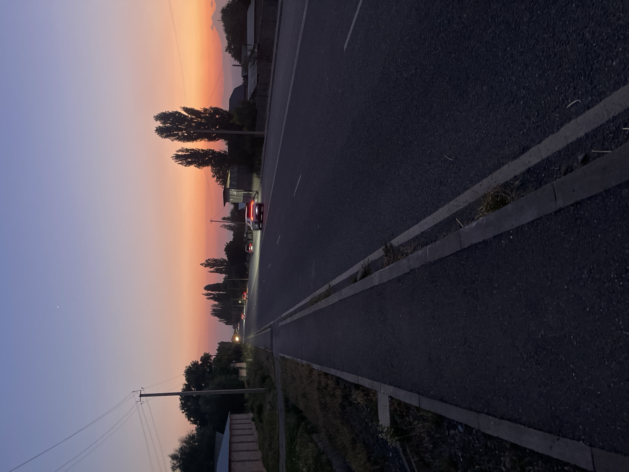 Dusk settles over a road in Taran-Bazar, Kyrgyzstan
