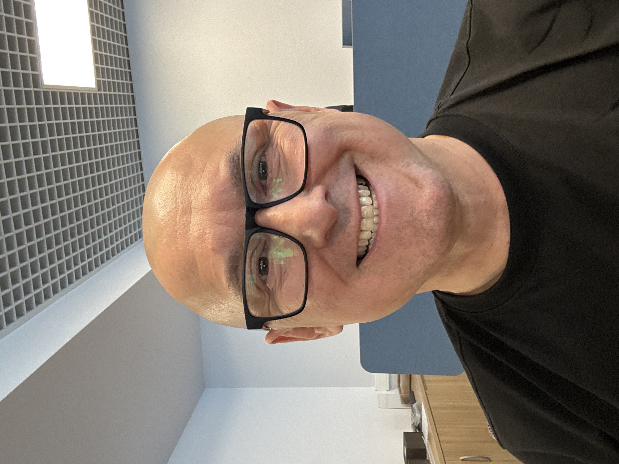 Smiling face in a Moscow office, mid-2026