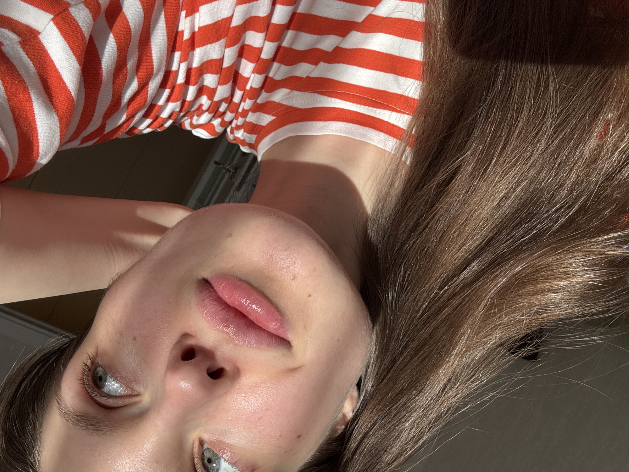 Person in striped shirt photographed indoors in Moscow residence