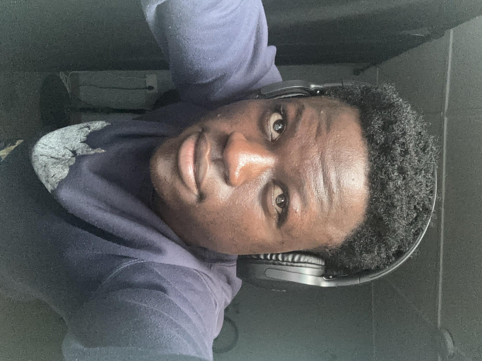 Laid-back morning at home in Badagry with eggs and headphones
