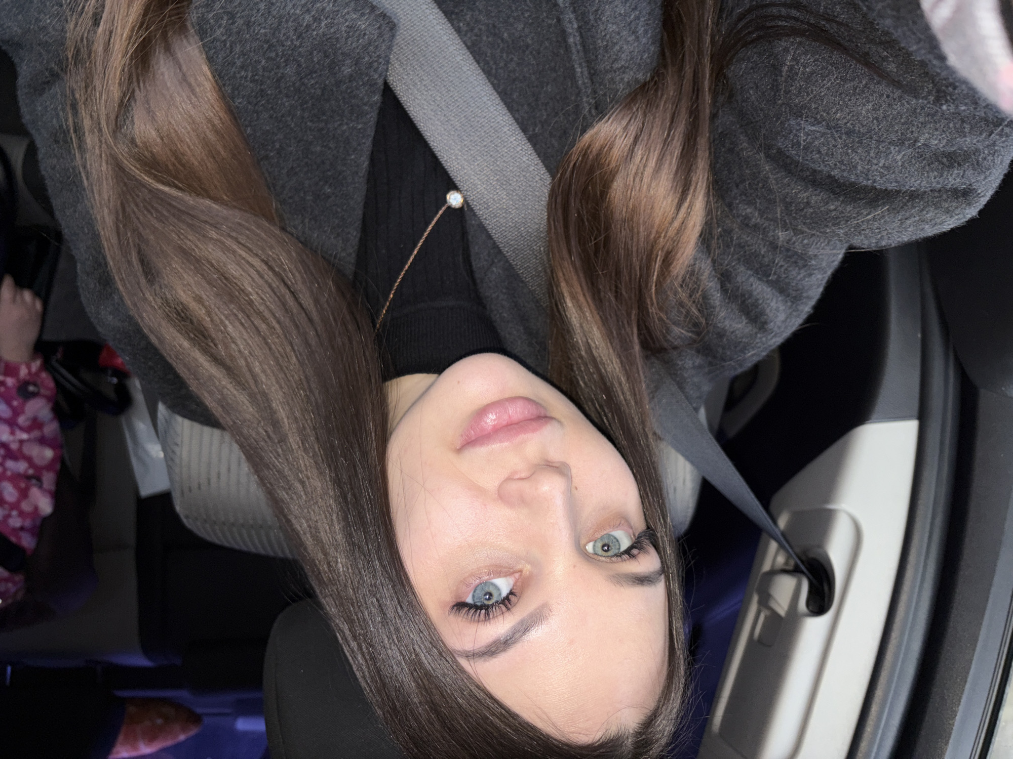 Woman observed in vehicle wearing dark coat in Chaikovsky