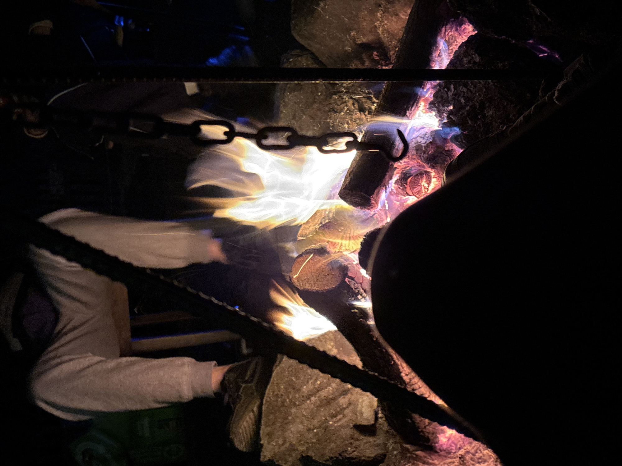 Nighttime campfire burns in enclosed area in Maglic, Serbia