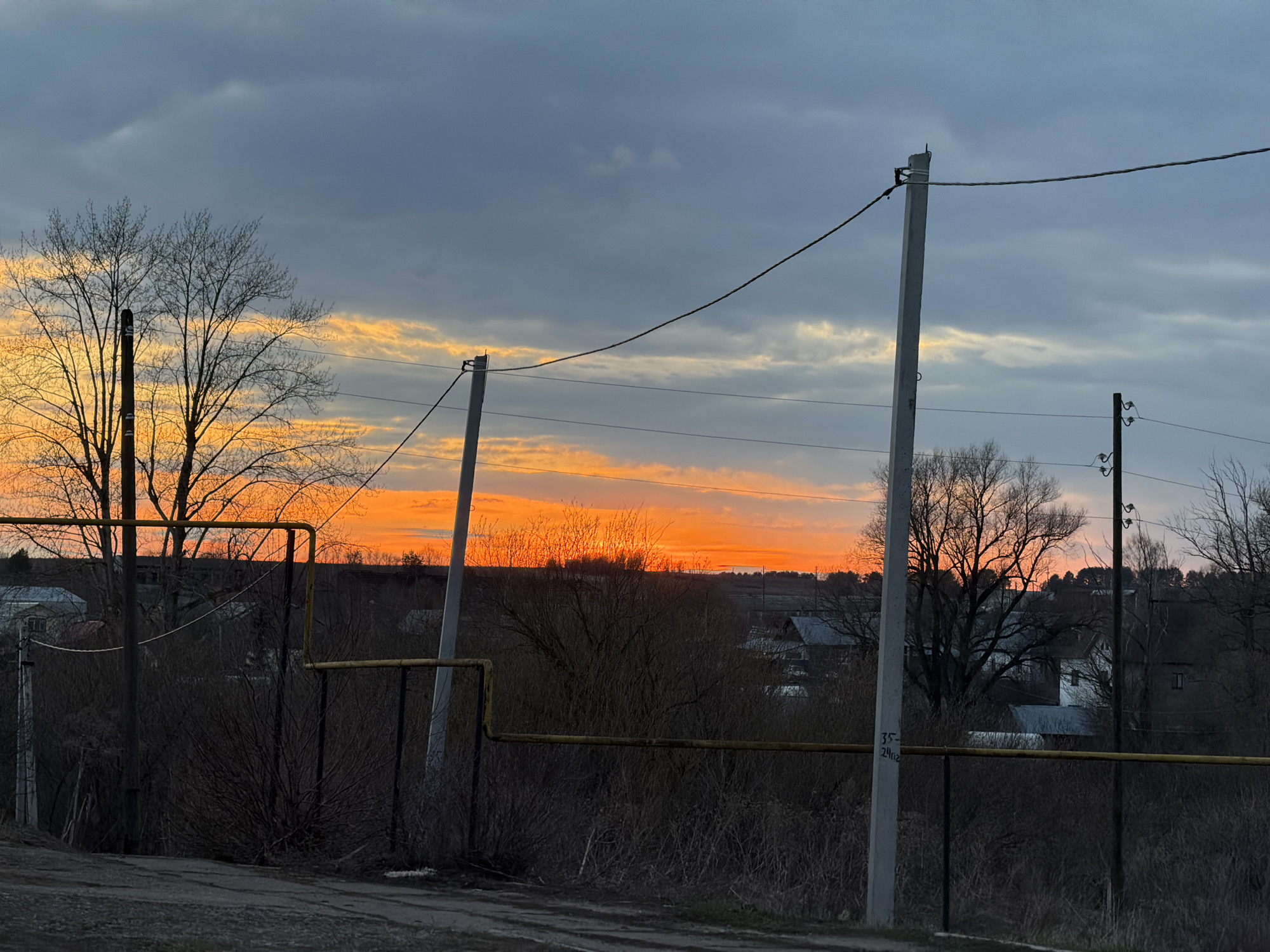 Dramatic sunset photographed over railway tracks in Kvarsa, Russia