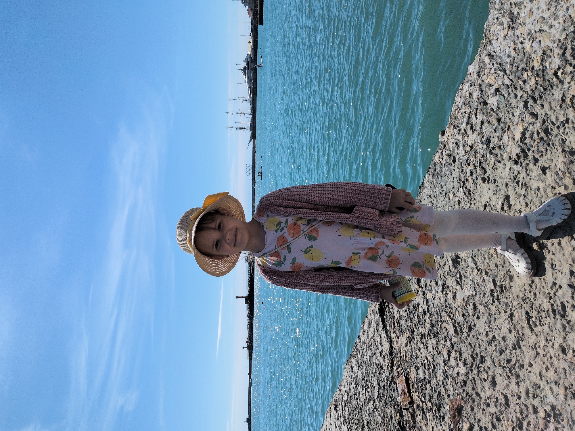 Young girl explores Sochi seaside attractions during afternoon outing