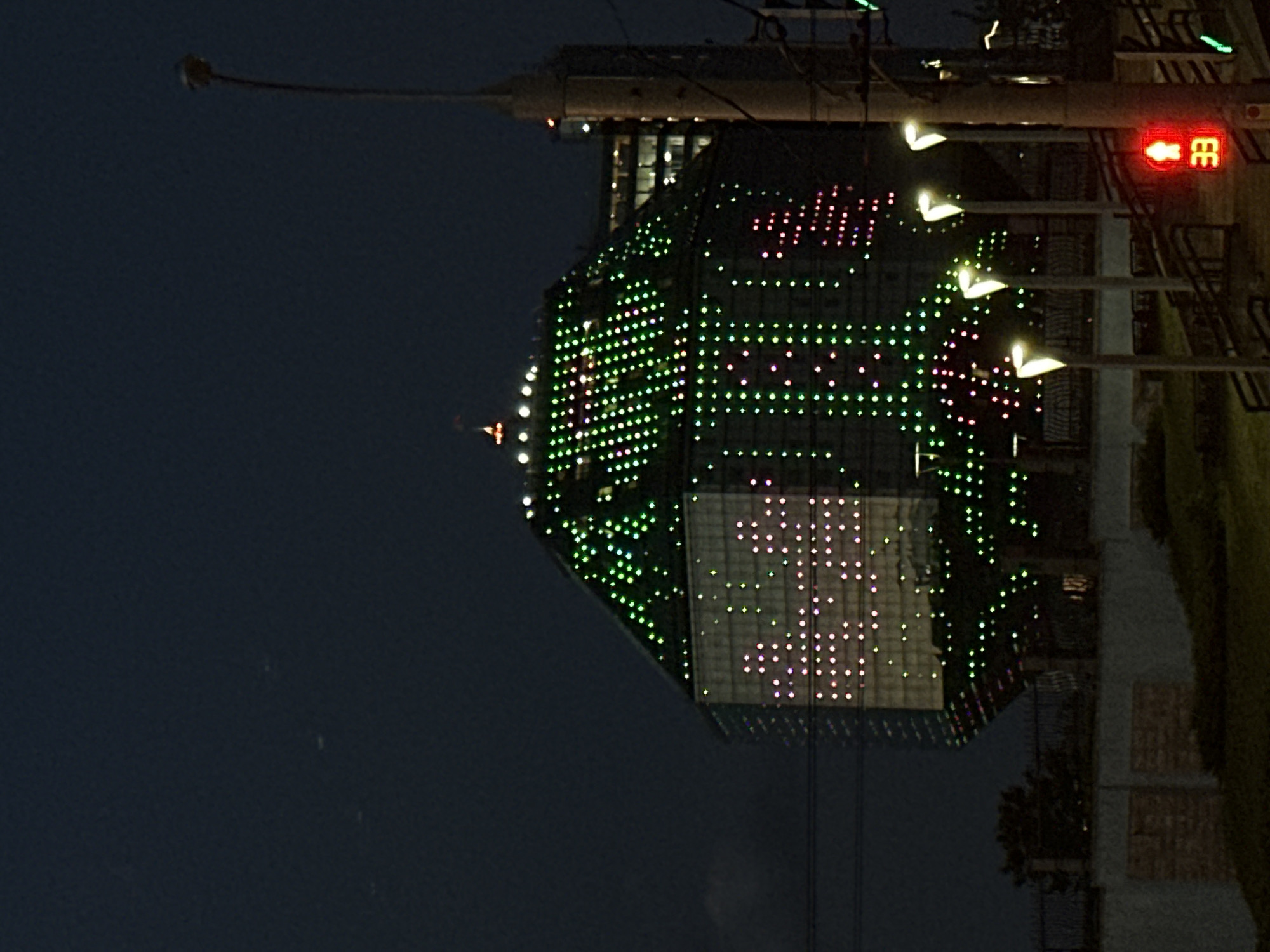 Minsk's illuminated National Library draws evening observers