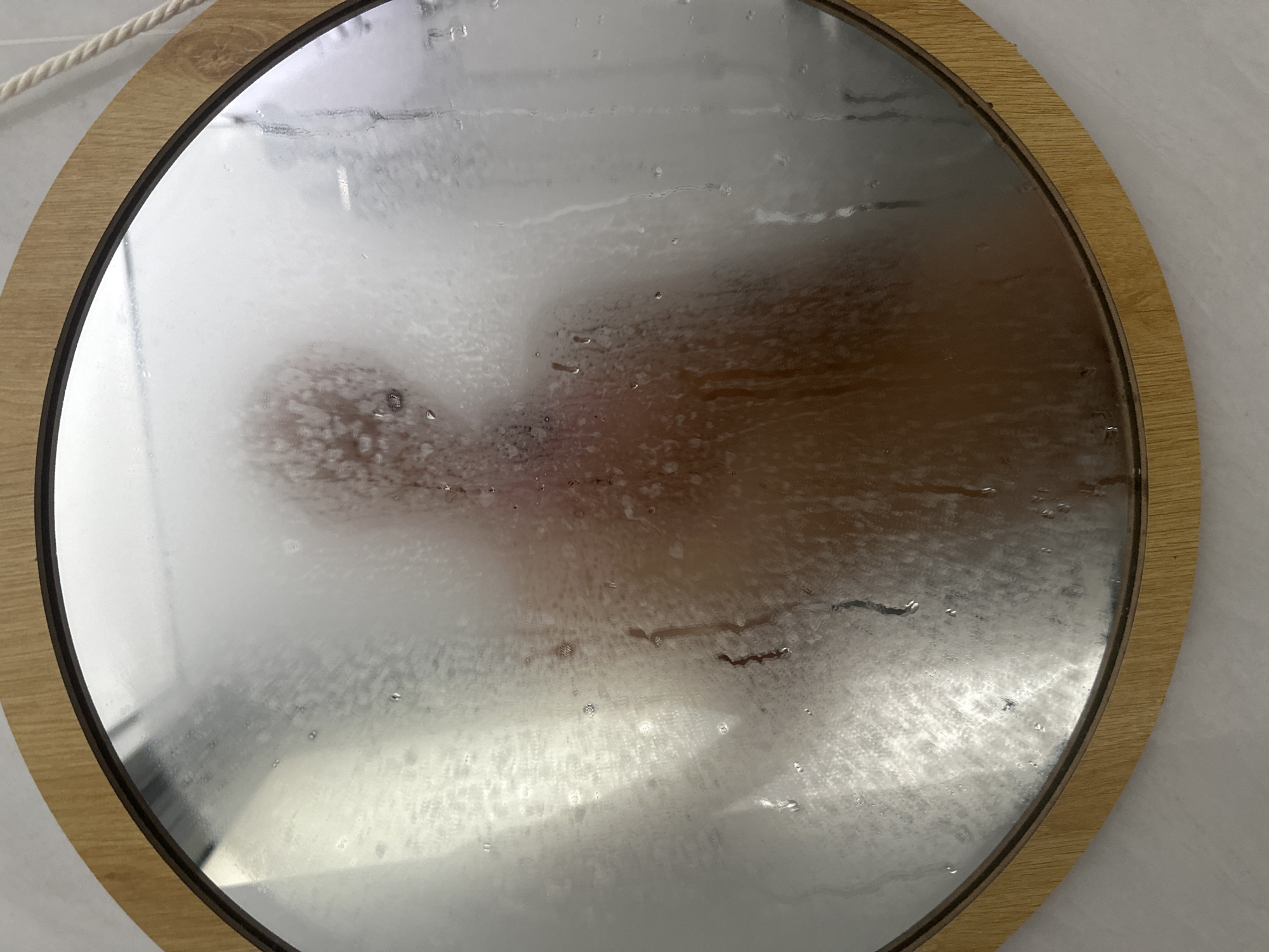 Person captured in fogged bathroom mirror in Vietnam