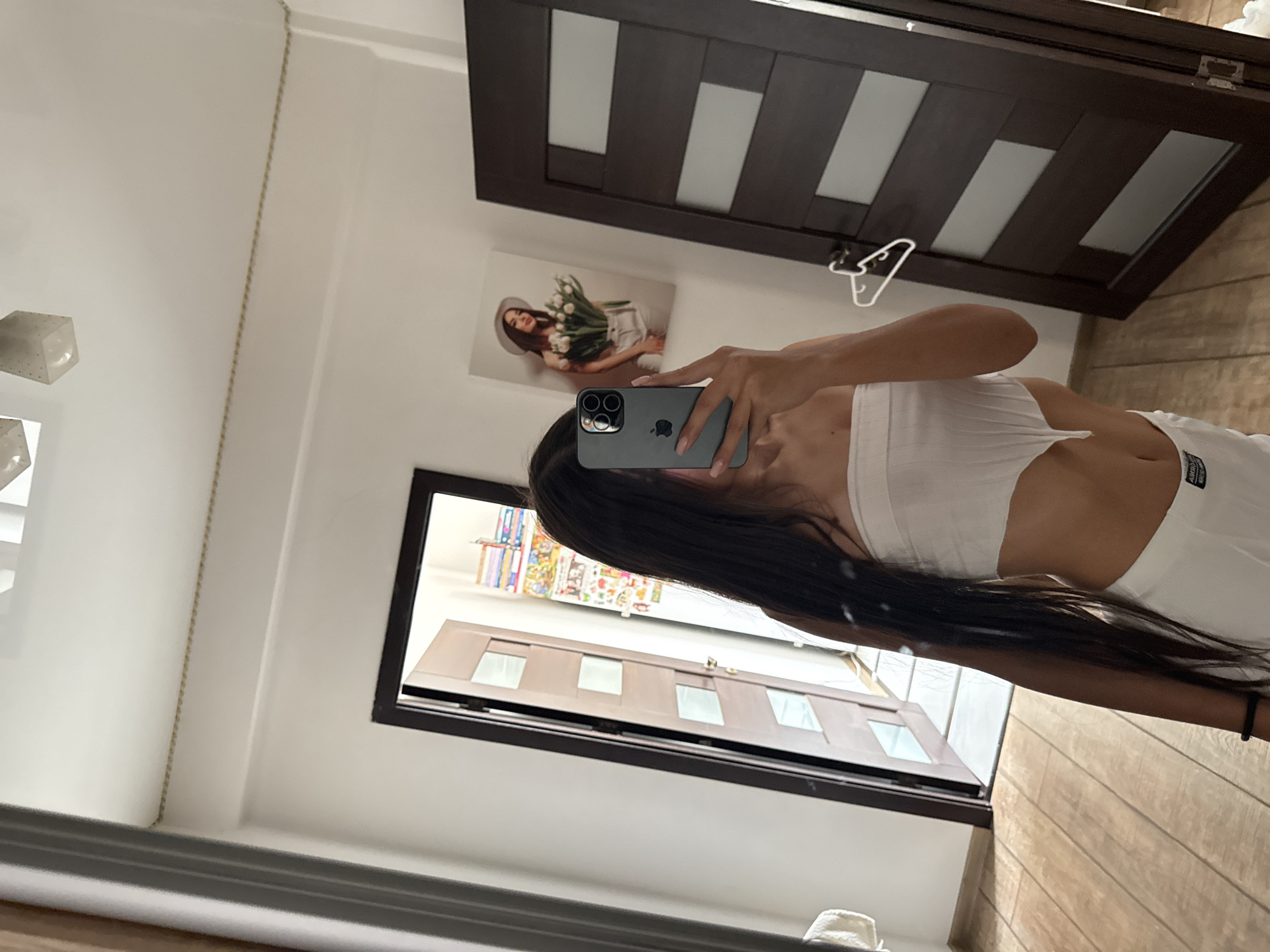 Mirror selfie session in a Chișinău bedroom, white outfit