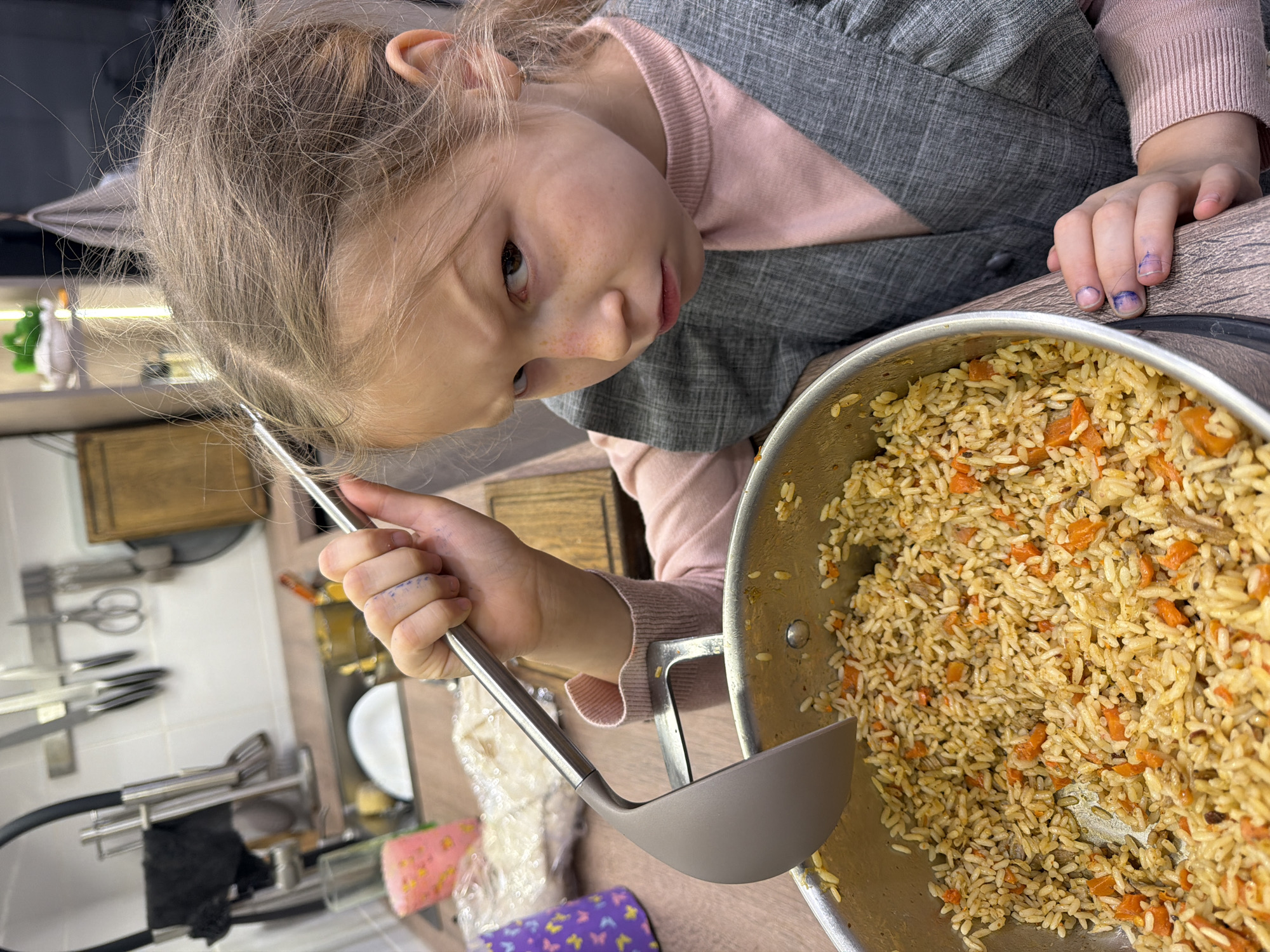 Russian household scenes feature girl cooking, pet rat play