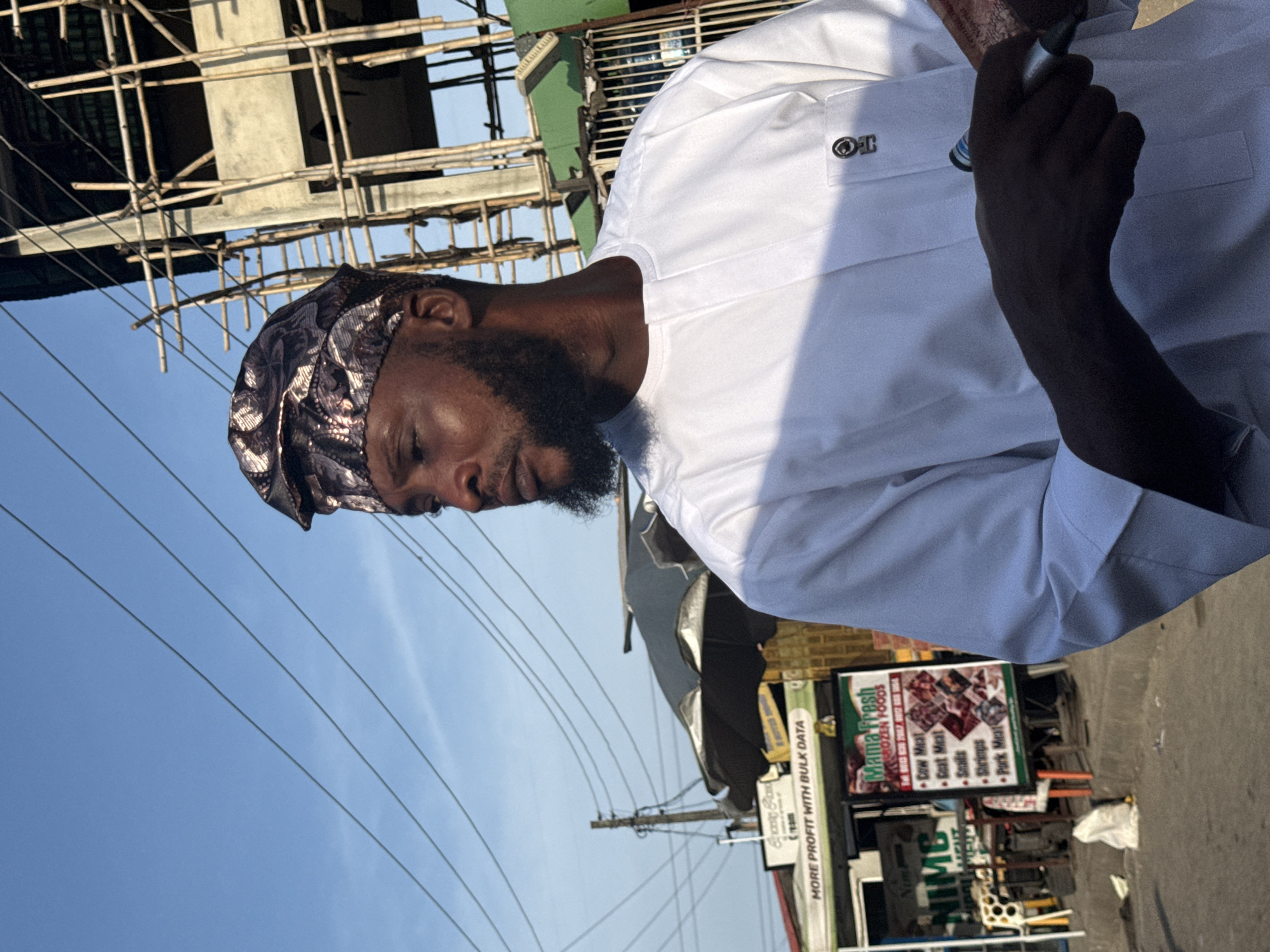 Street scene documented in Ado, Nigeria amid commercial activity
