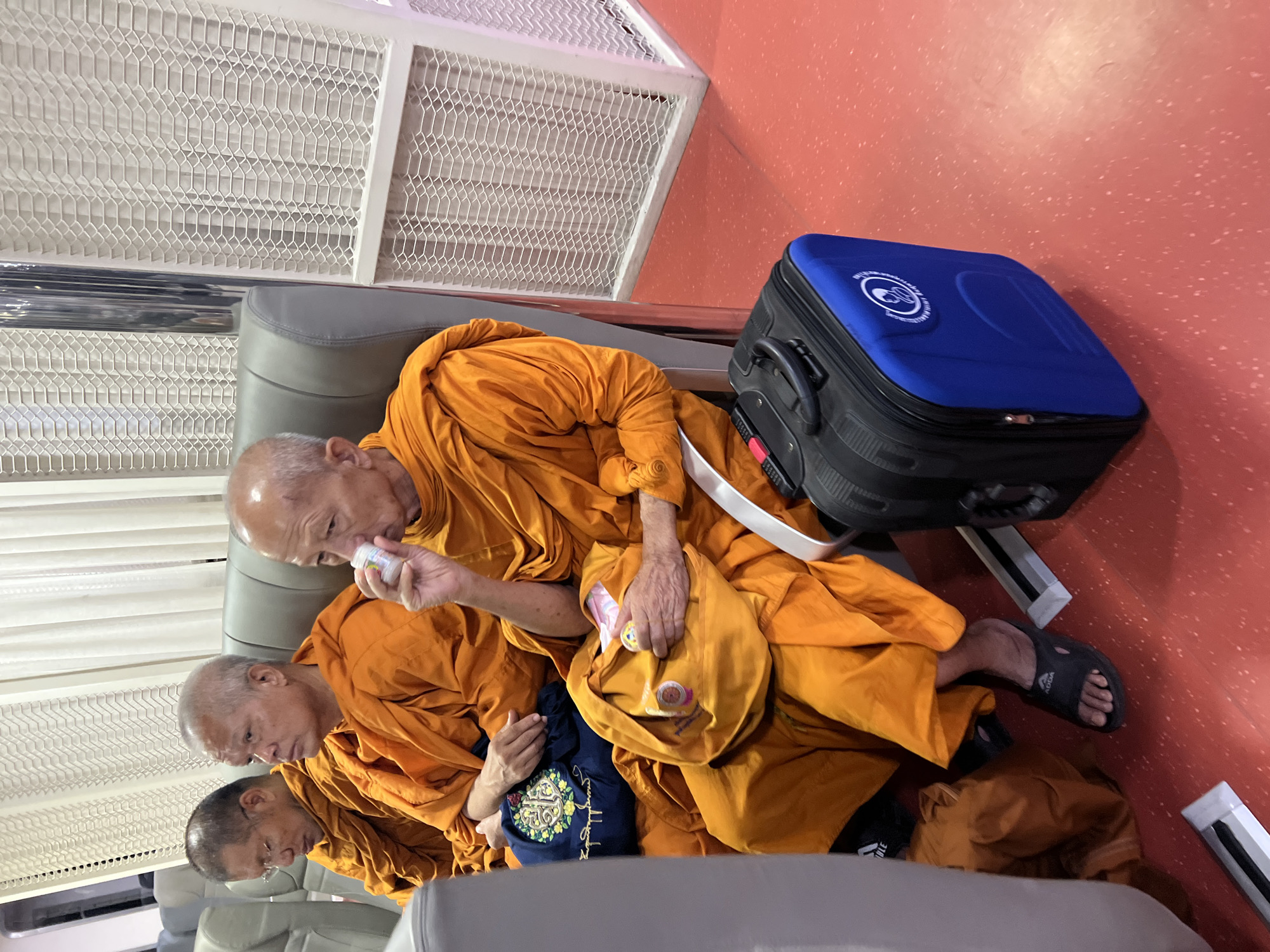 Monks in a vehicle and bold footwear, Nathon streets