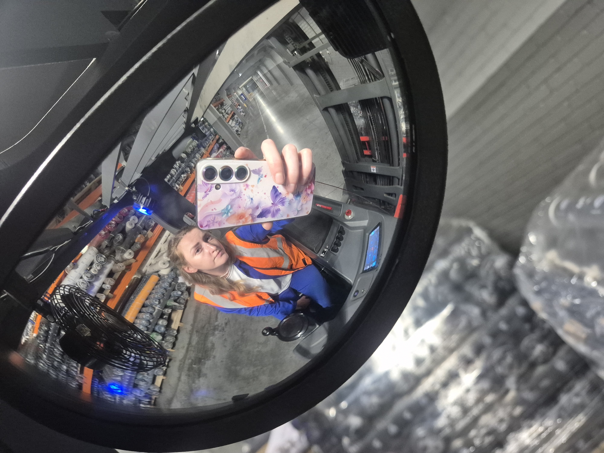 Forklift mirror selfie from a warehouse in Chaikovsky, Russia