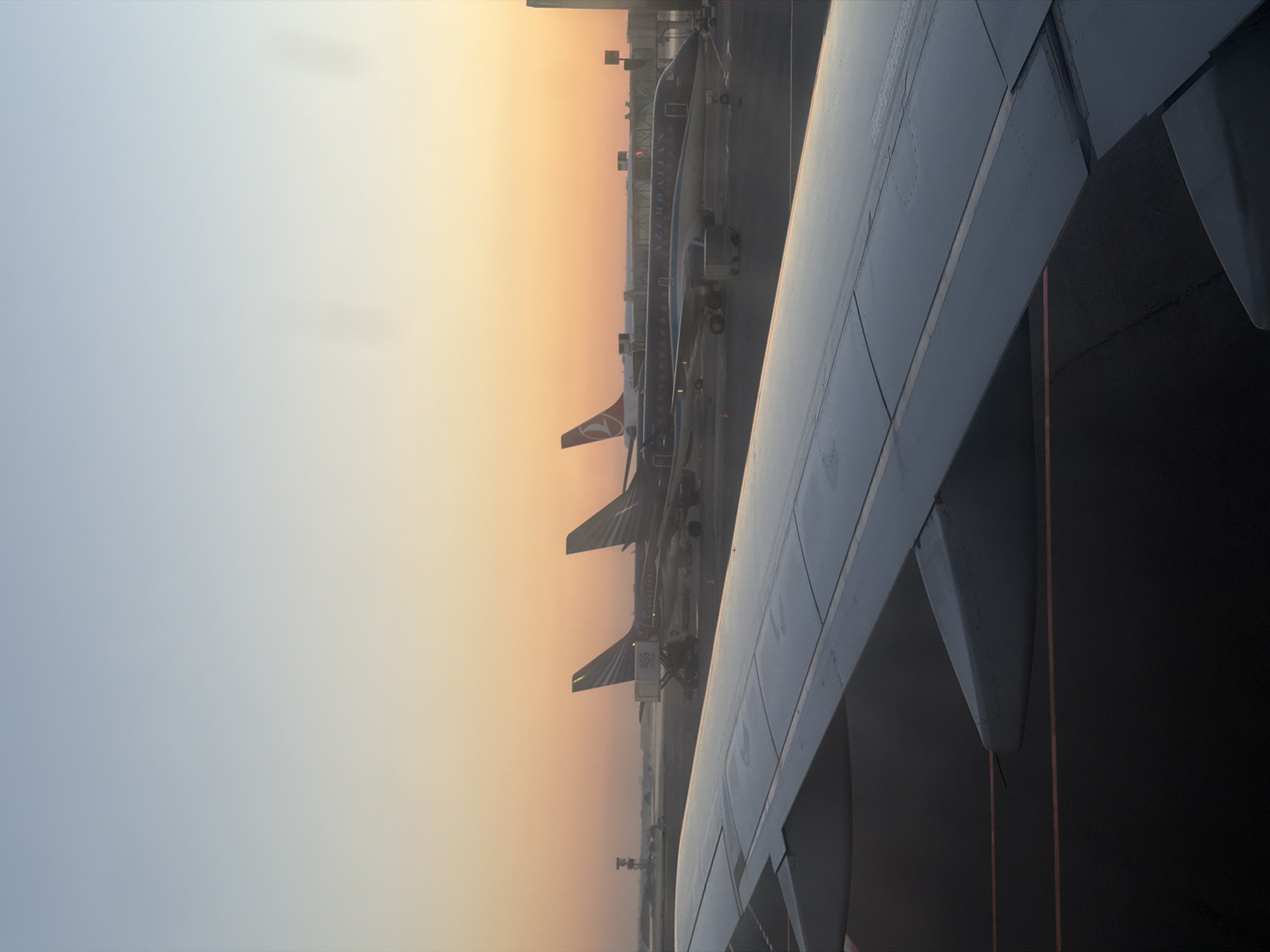 Dawn activity at Baku's Heydar Aliyev Airport, Azerbaijan Airlines on the tarmac